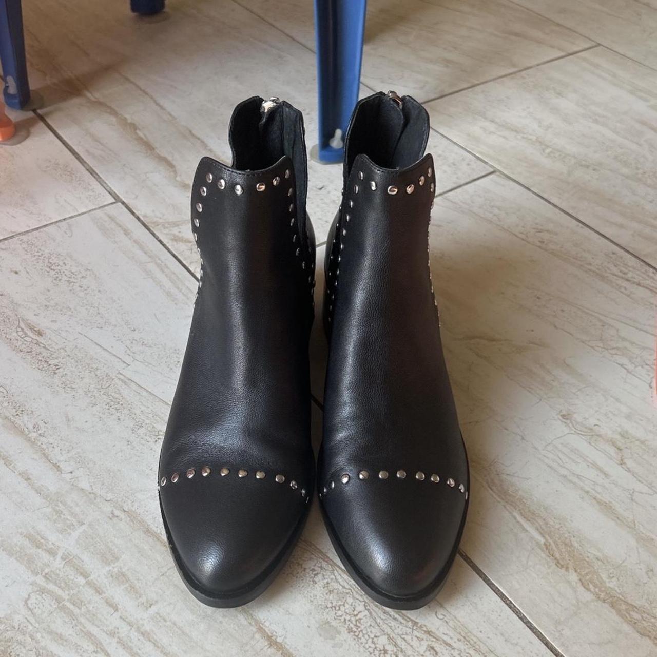Black leather ankle boots with silver studs