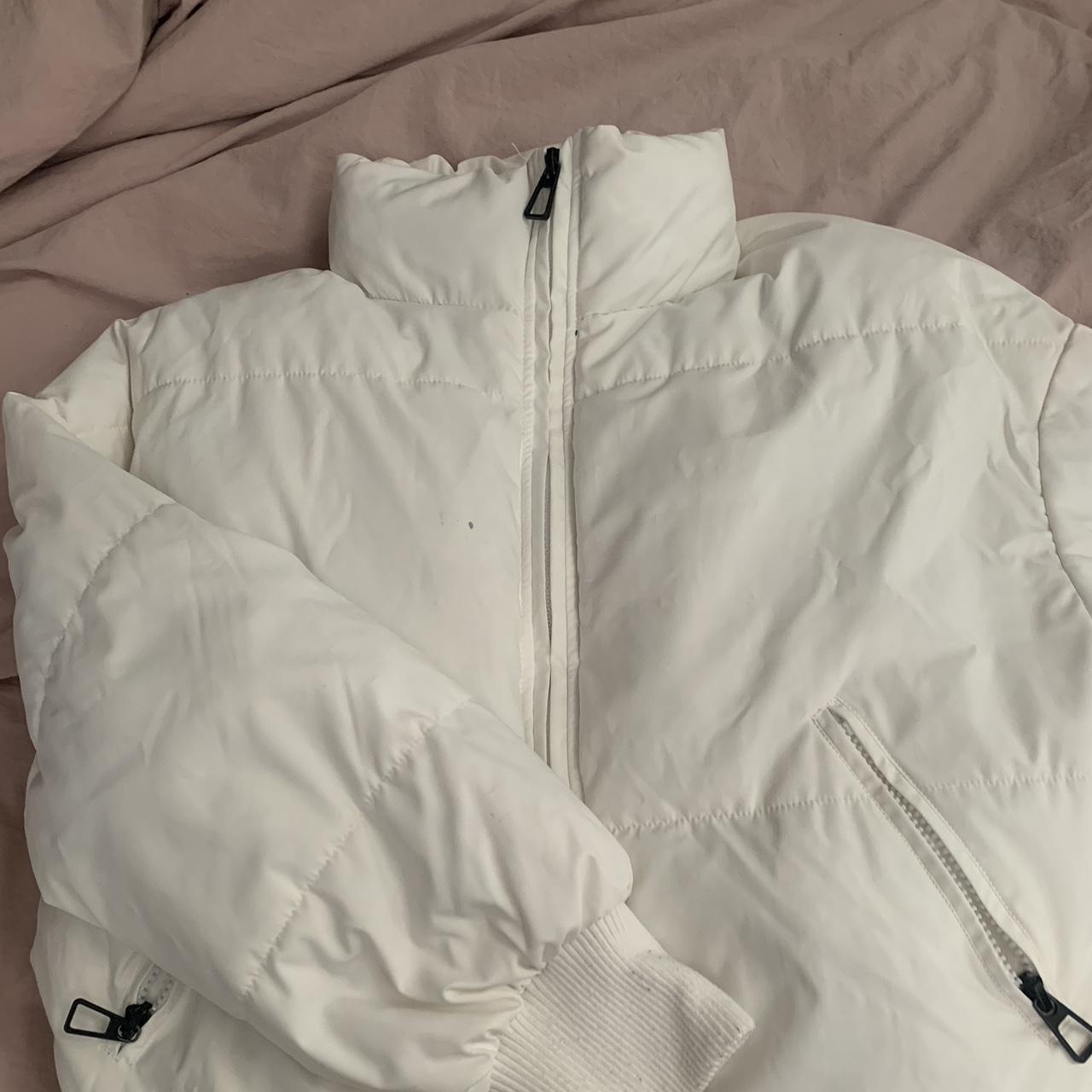 White puffer jacket Size xs Small black stain on... - Depop