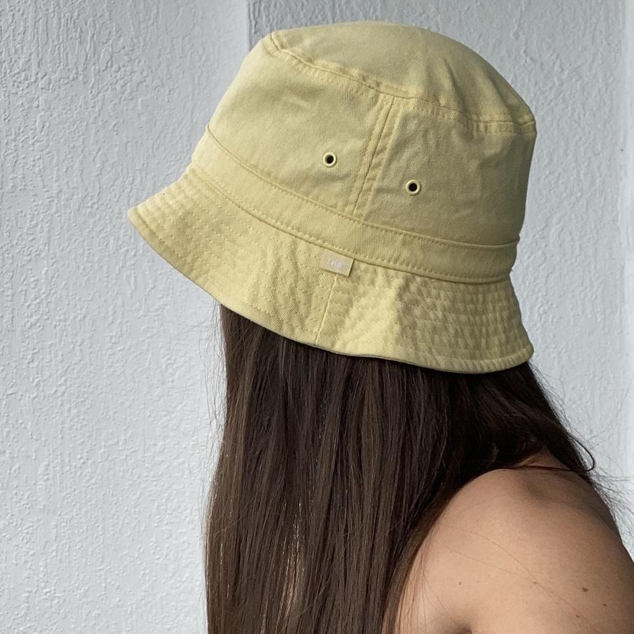 TNA Pastel Butter Yellow Bucket Hat Sold at... - Depop