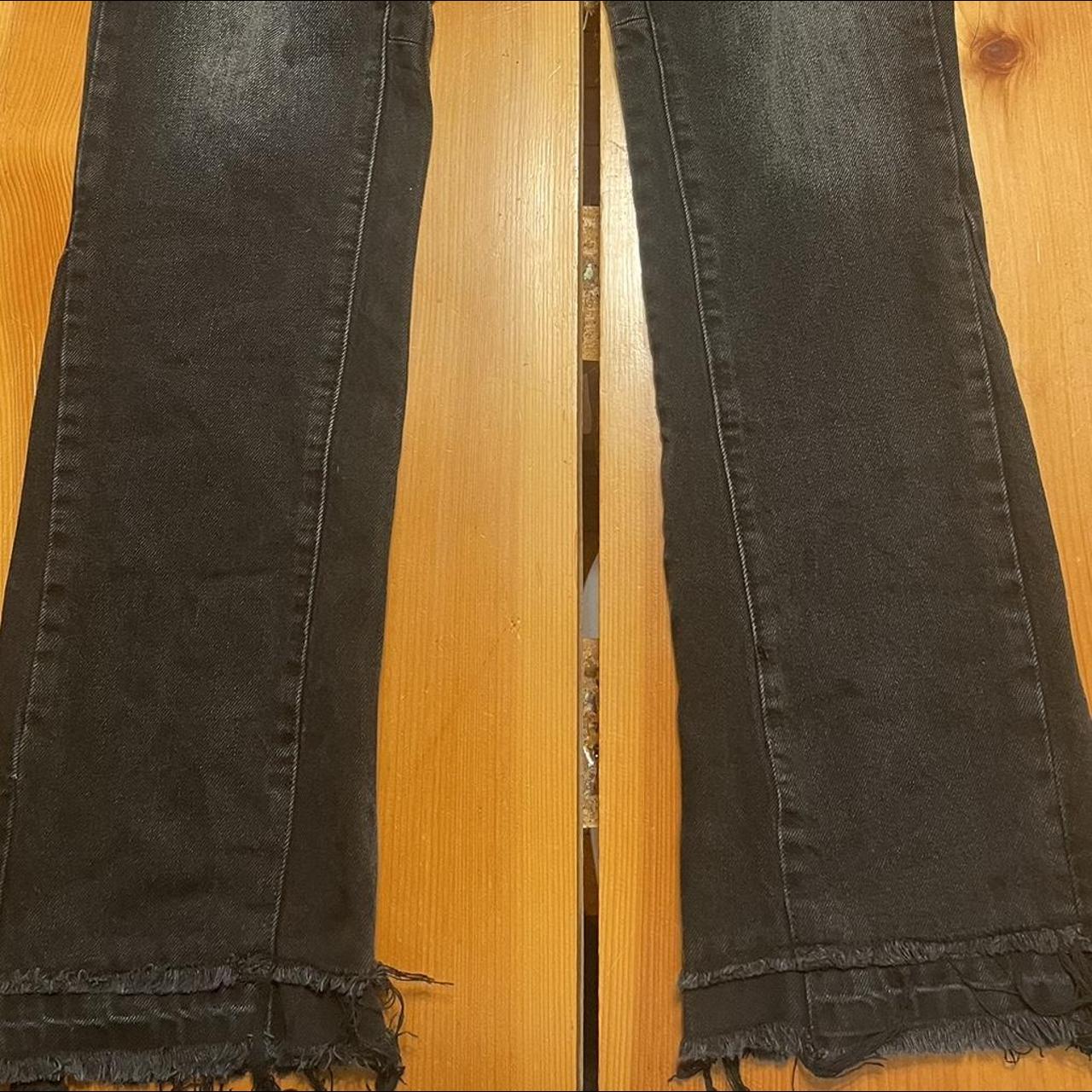 some pretty cool black flared jeans distressed... - Depop
