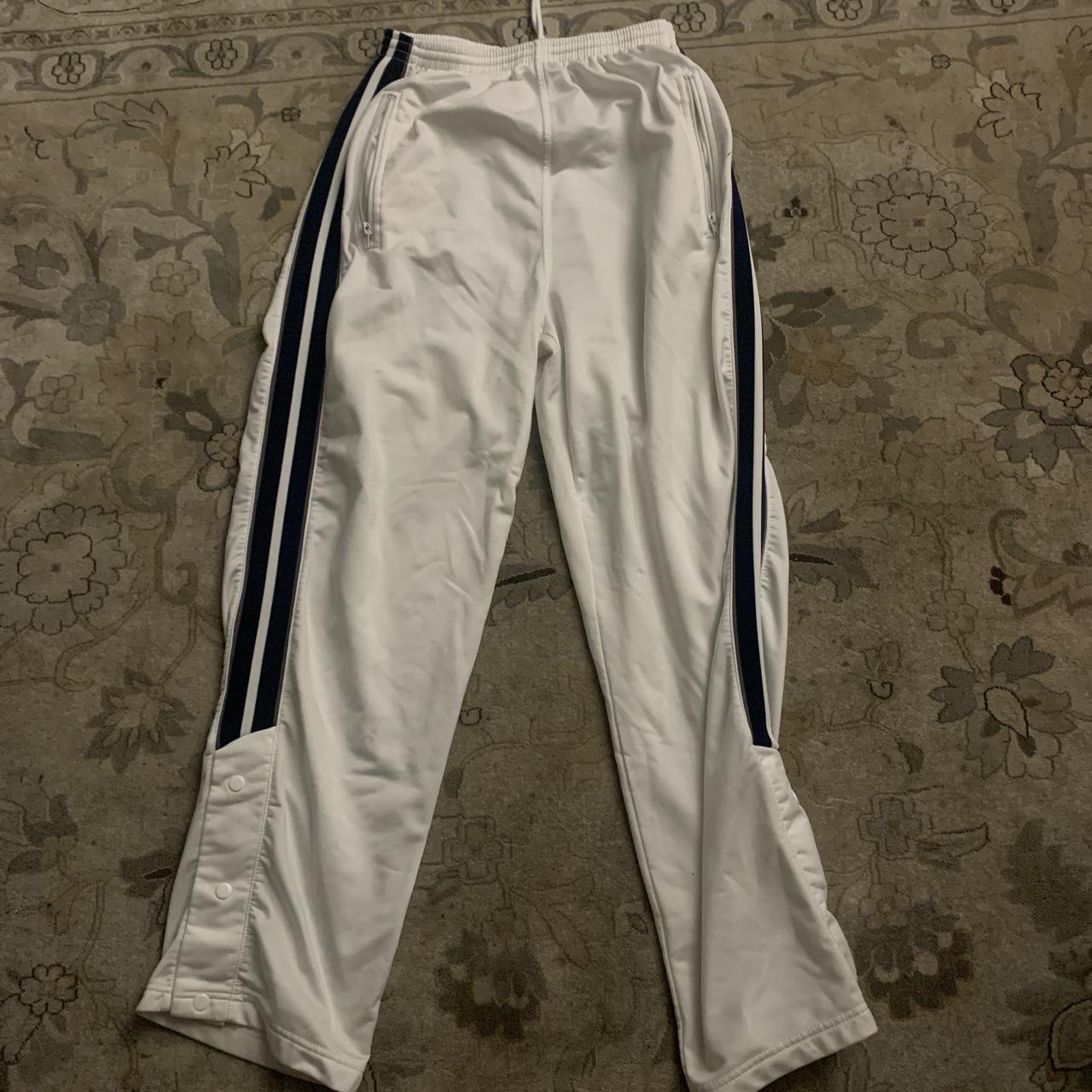 White and black track pants size large with a... - Depop