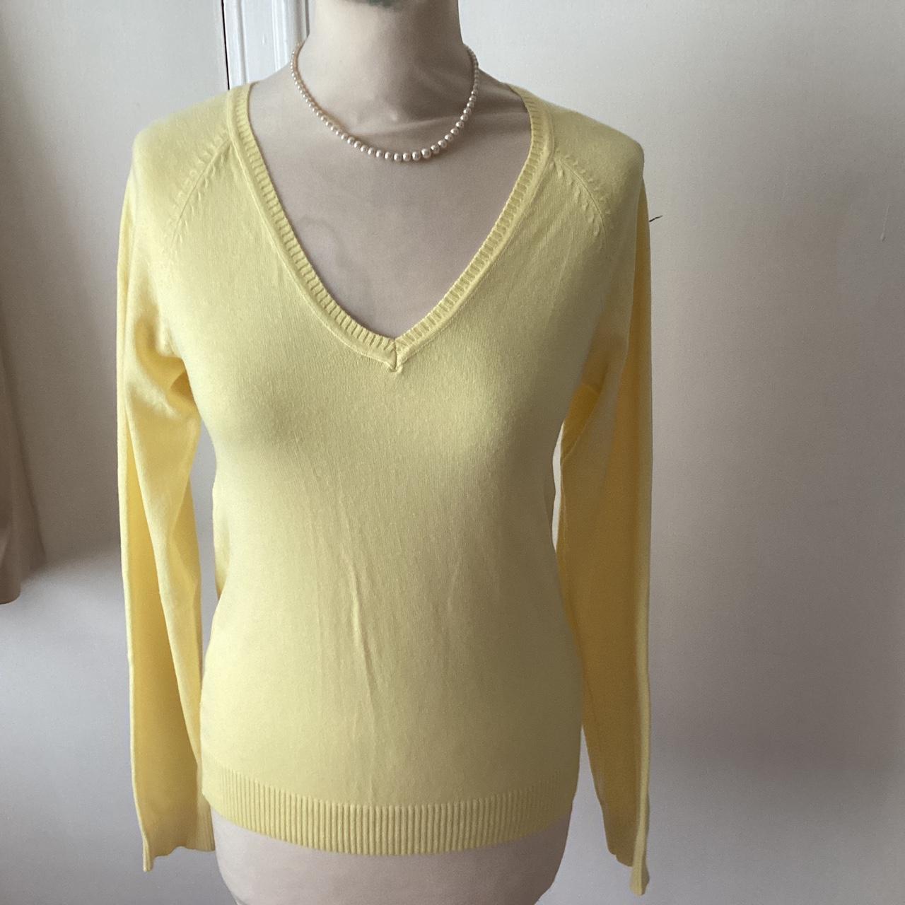A yellow V-neck sweater labelled Zara that was owned... - Depop