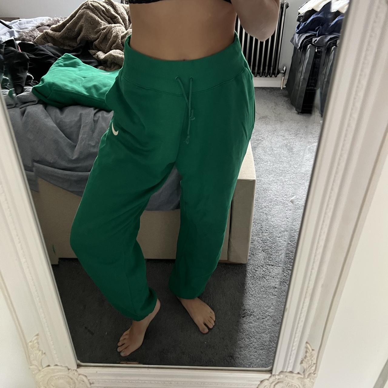 Nike green tracksuit bottoms.. super comfy are quite... Depop
