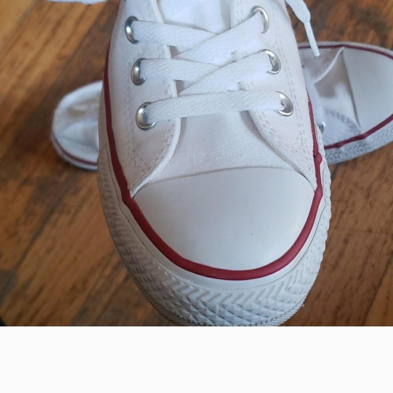 Converse with red sales stripe on sole