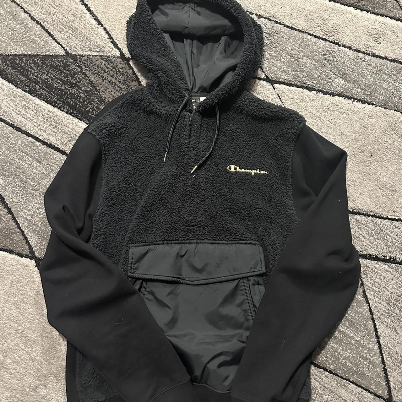 Black champion hoodie store with gold logo