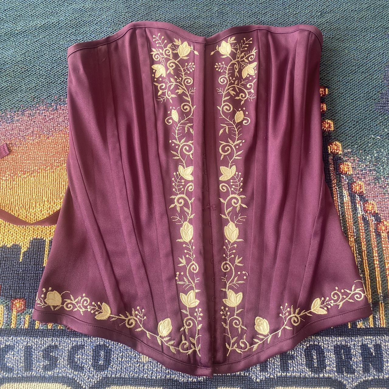 purple corset with white floral… - Depop