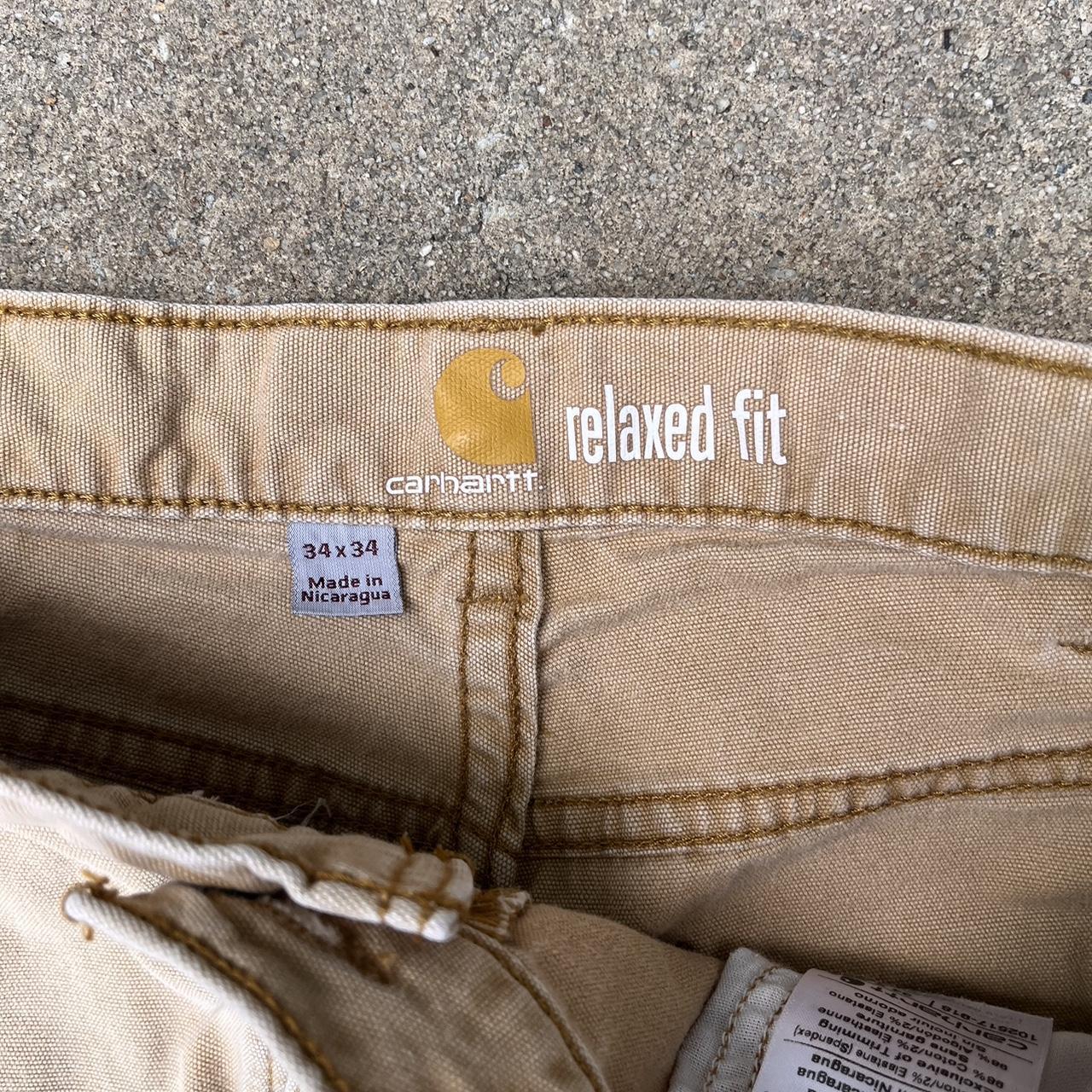 cute modern carhartt tan pants with cell phone... - Depop