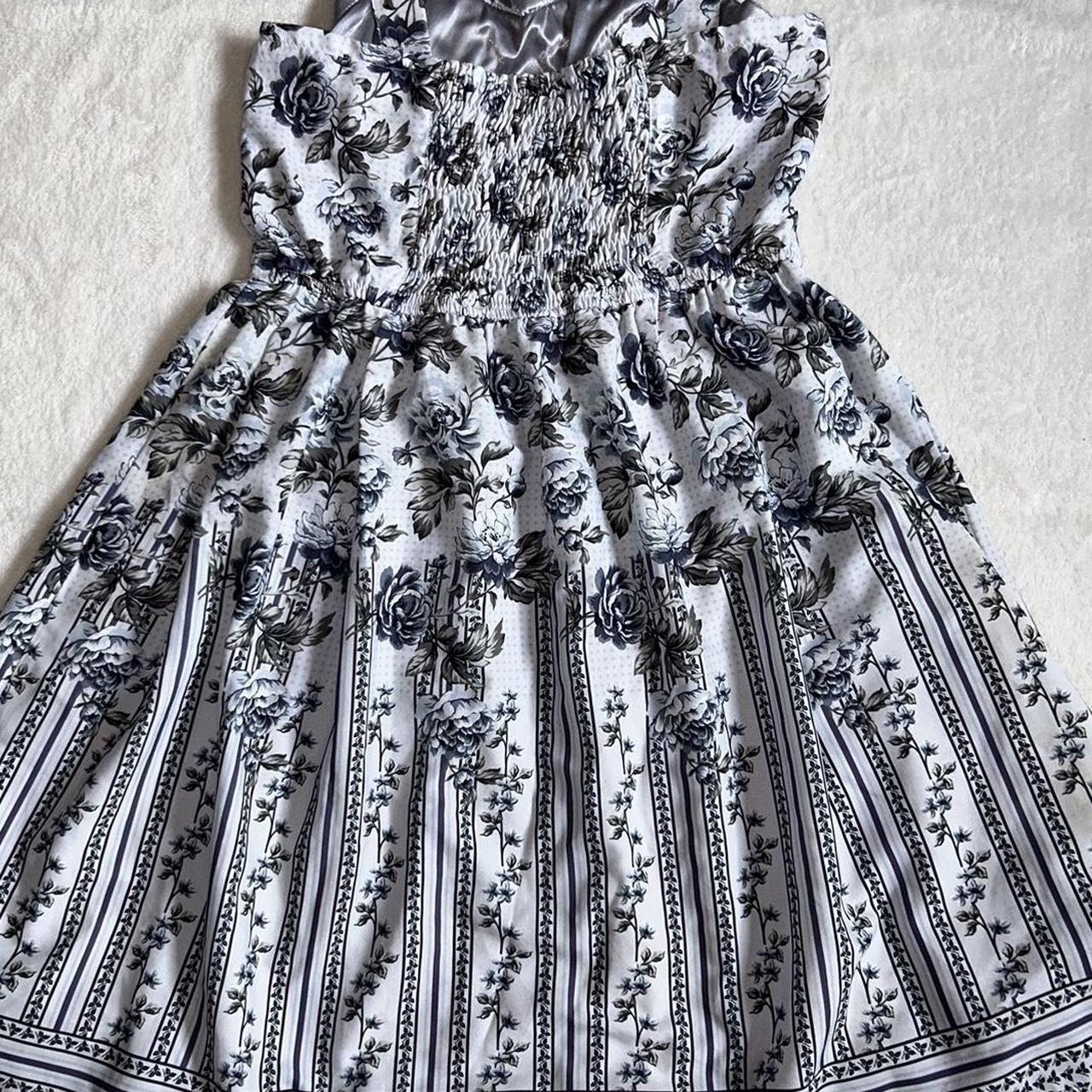 axes femme blue floral dress. fits size small. super... Depop