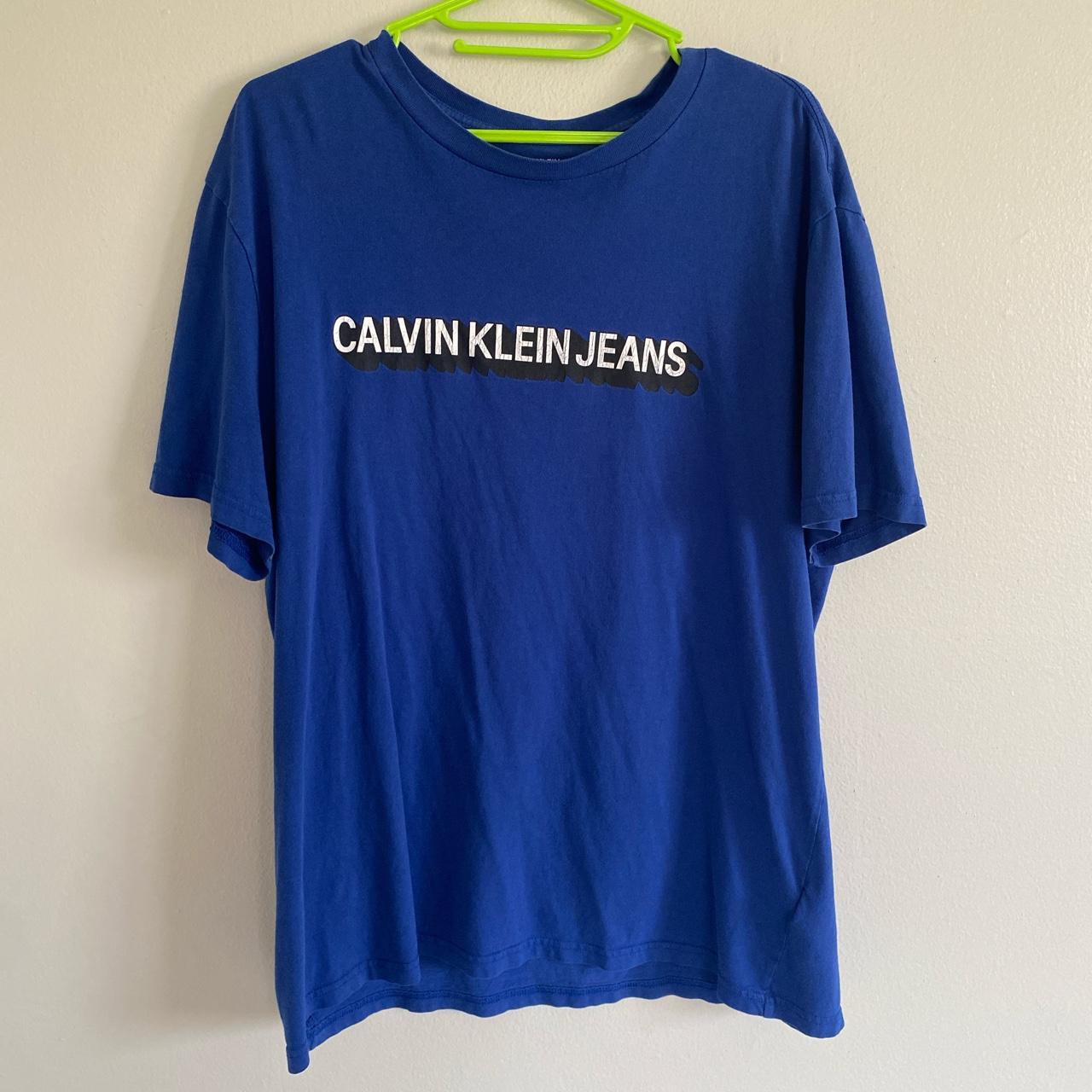 Blue Calvin Klein Jeans T shirt. Graphic has slight... - Depop