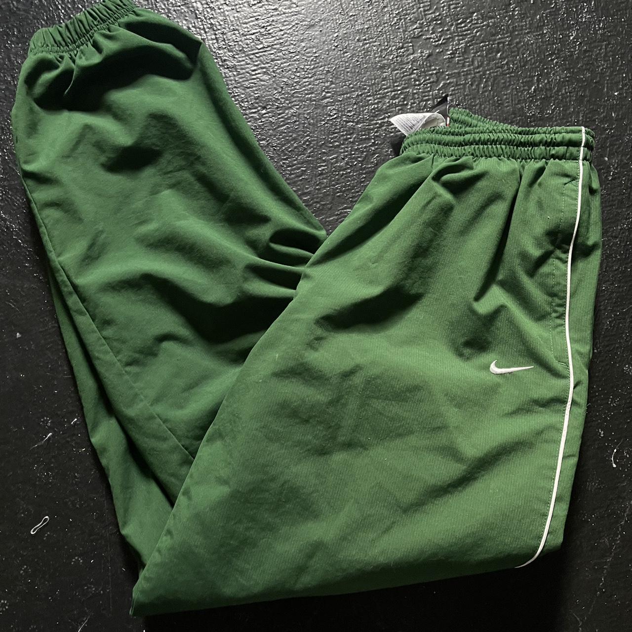 green vintage nike track pants damage on bottom... Depop