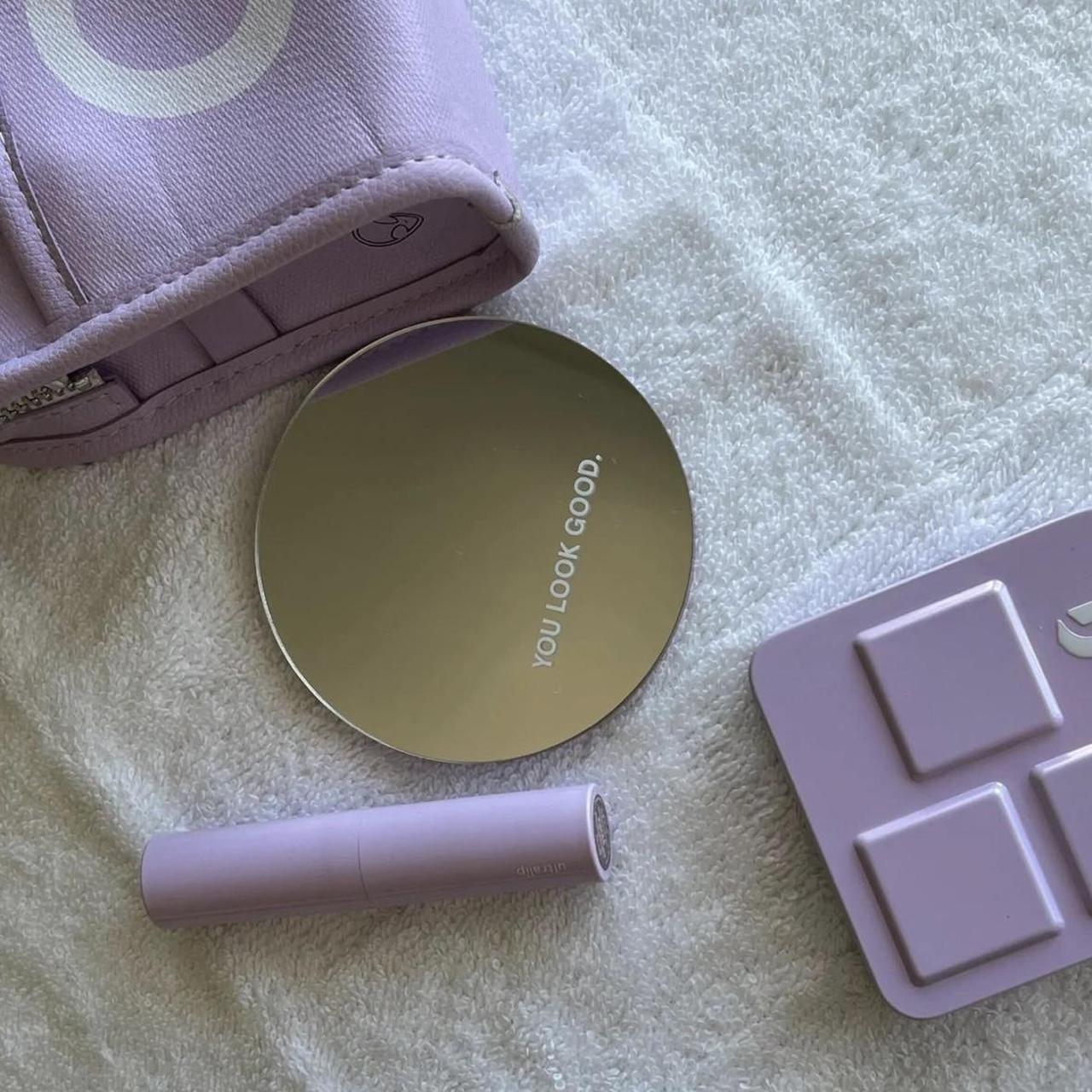 Olivia x Glossier makeup bag for those who don't want to go