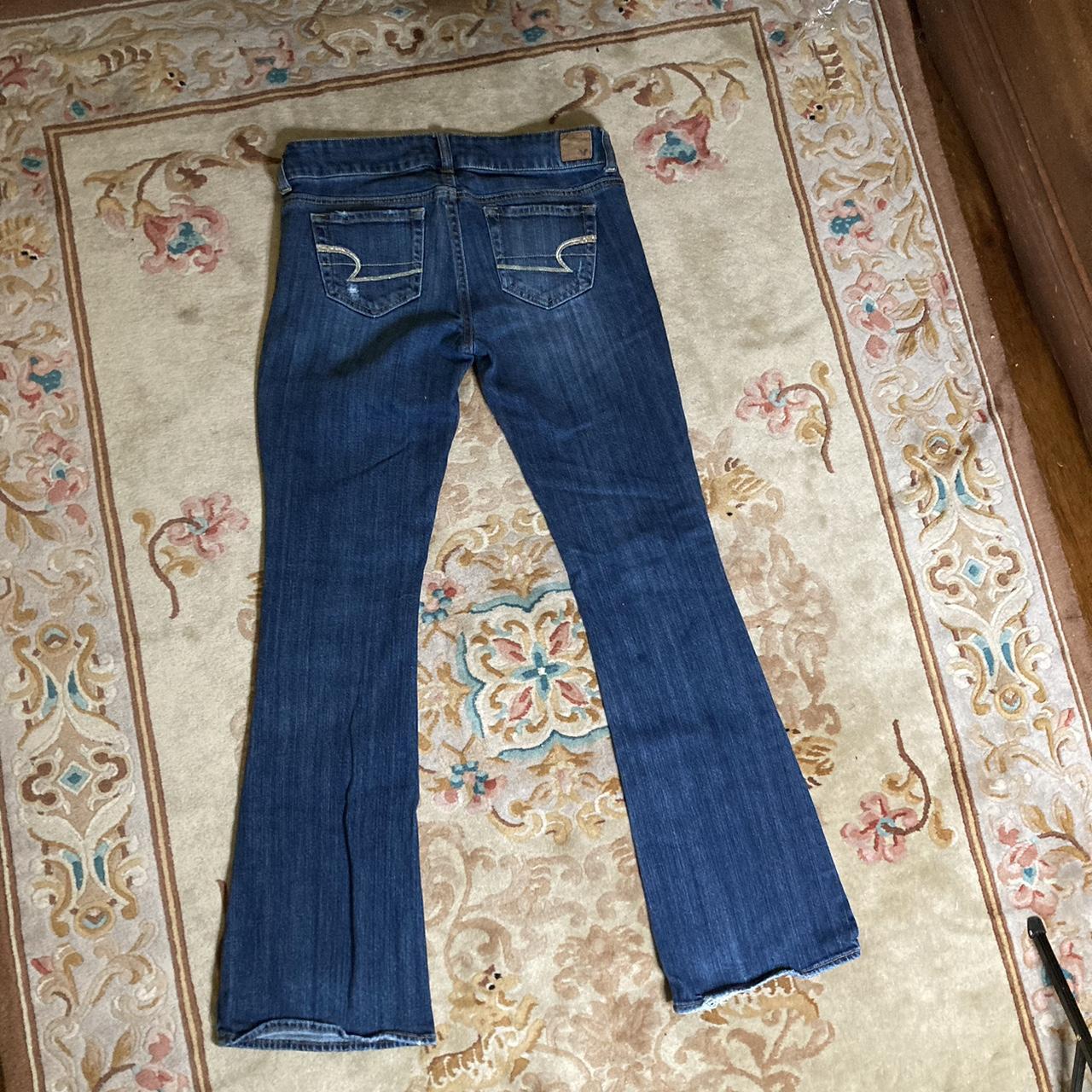 Low rise bootcut dark wash distressed jeans from... - Depop