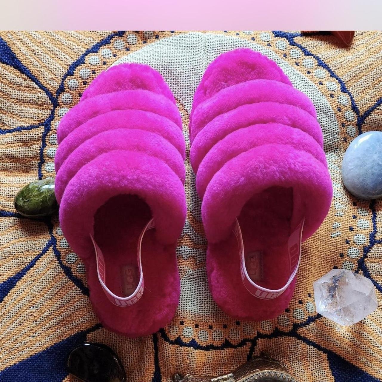 Fluffy hot pink Ugg slippers with the elastic heel