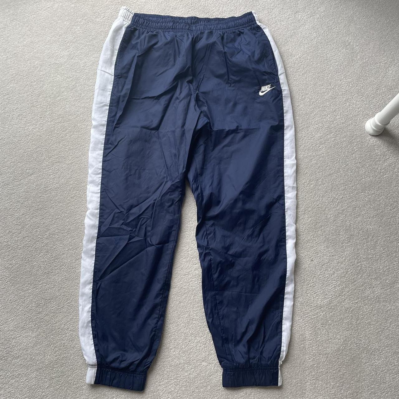 Nike track joggers, navy with with side... - Depop