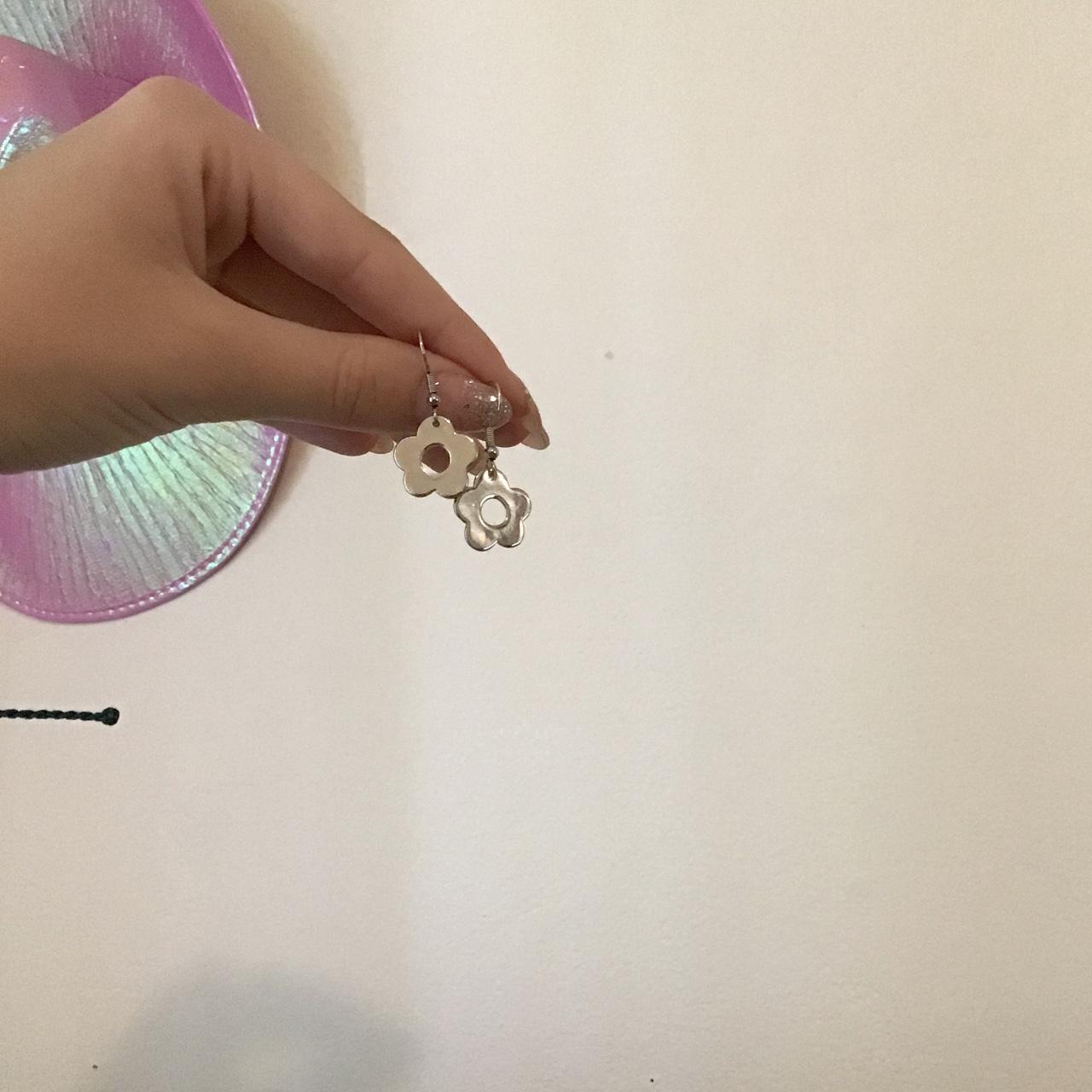 flower earrings from brandy melville, silver never... Depop