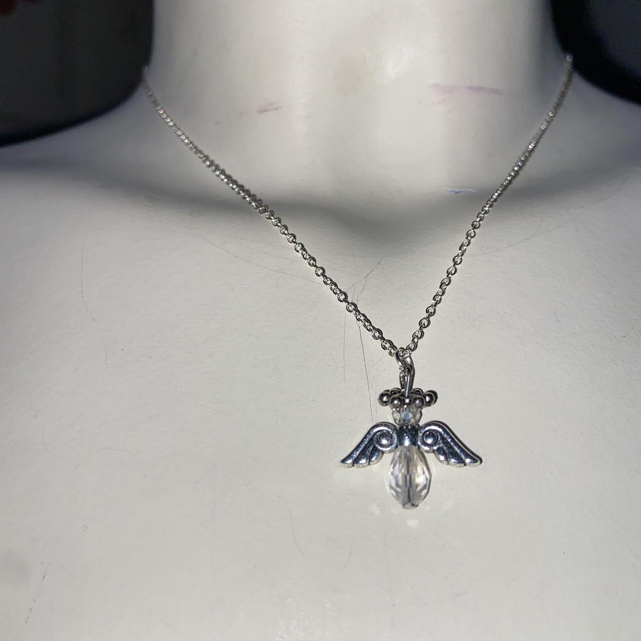 clear coloured beaded angel necklace free... Depop