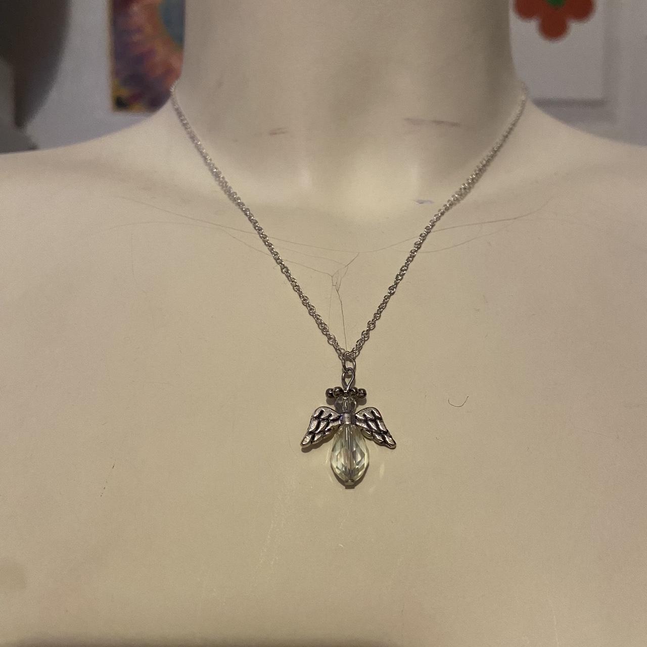 clear coloured beaded angel necklace free... Depop