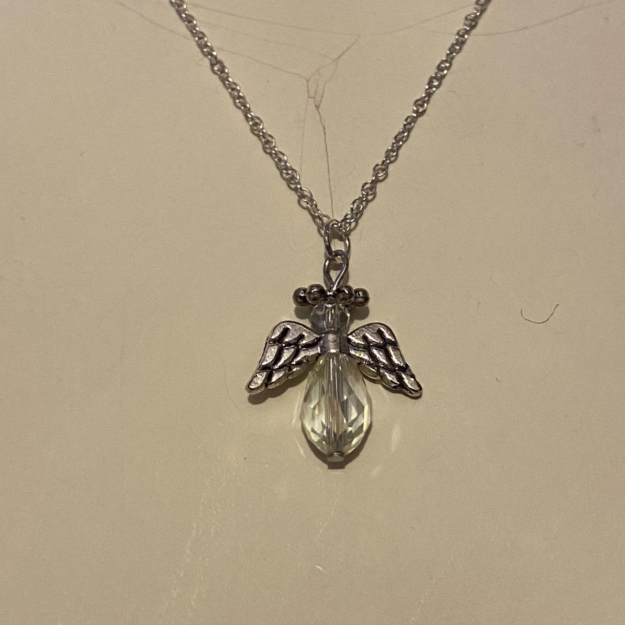 clear coloured beaded angel necklace free... Depop