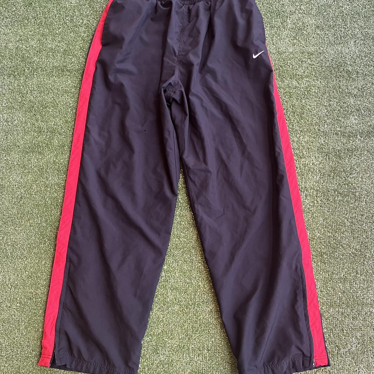 Nike track best sale pants red stripe