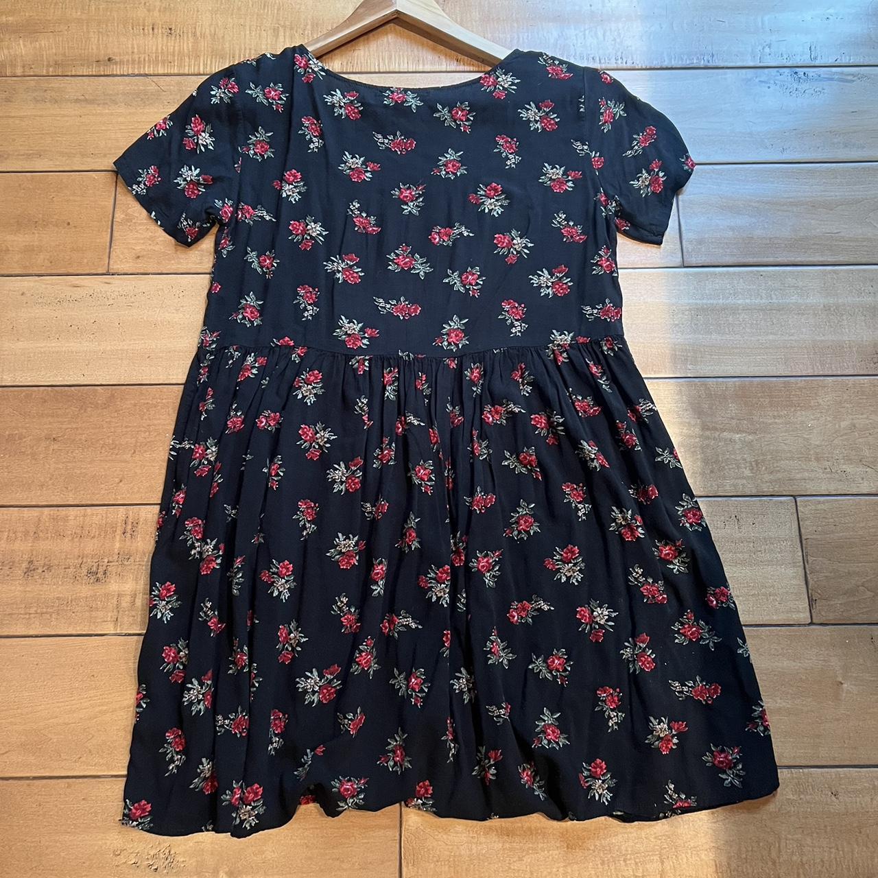 Brandy Melville babydoll dress. Black with floral... Depop