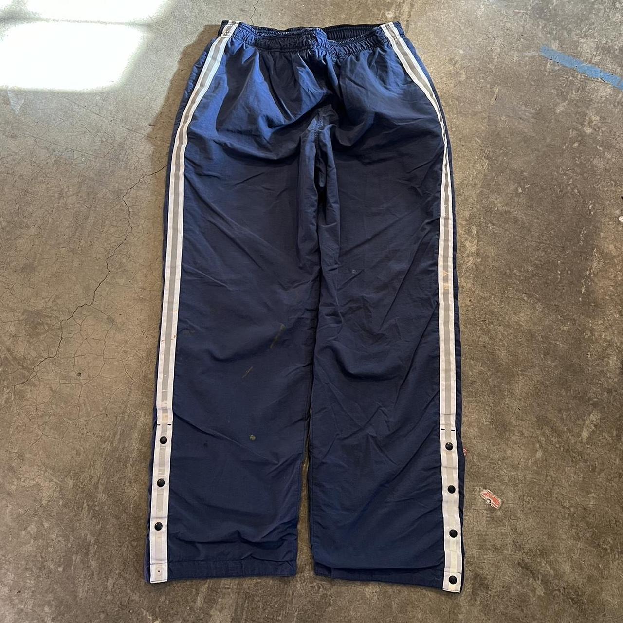 Vintage baggy track pants with button flare at... - Depop