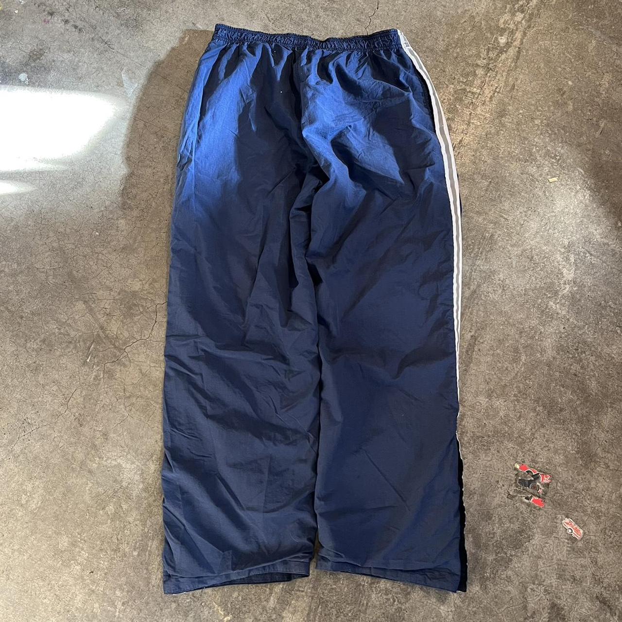 Vintage baggy track pants with button flare at... - Depop