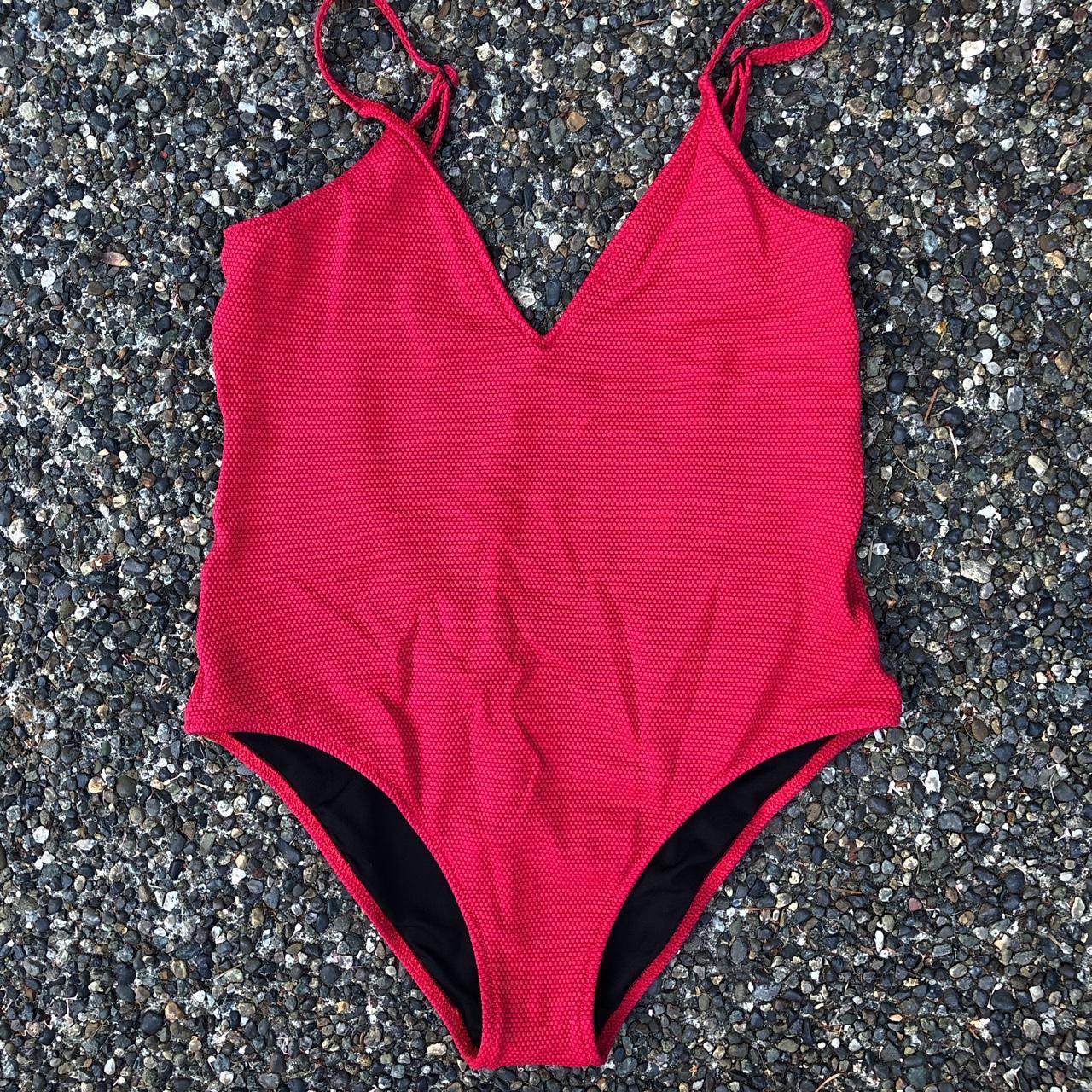 Flattering one piece red swimsuit Purchased from... Depop
