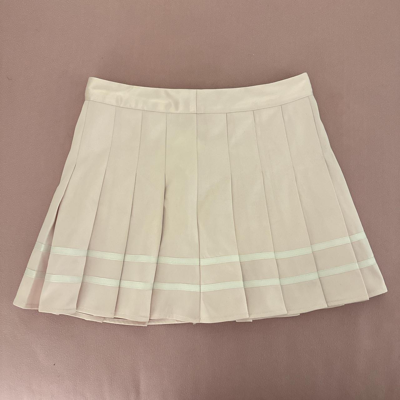 pink pleated mini skirt. resembles a cheer skirt