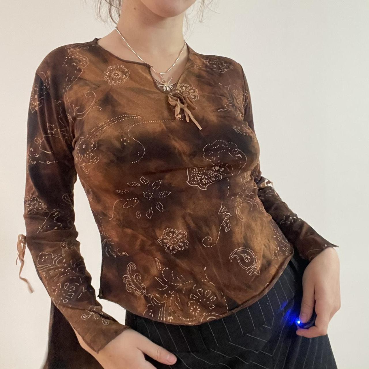 brown slinky long sleeve top with flared sleeves and... - Depop