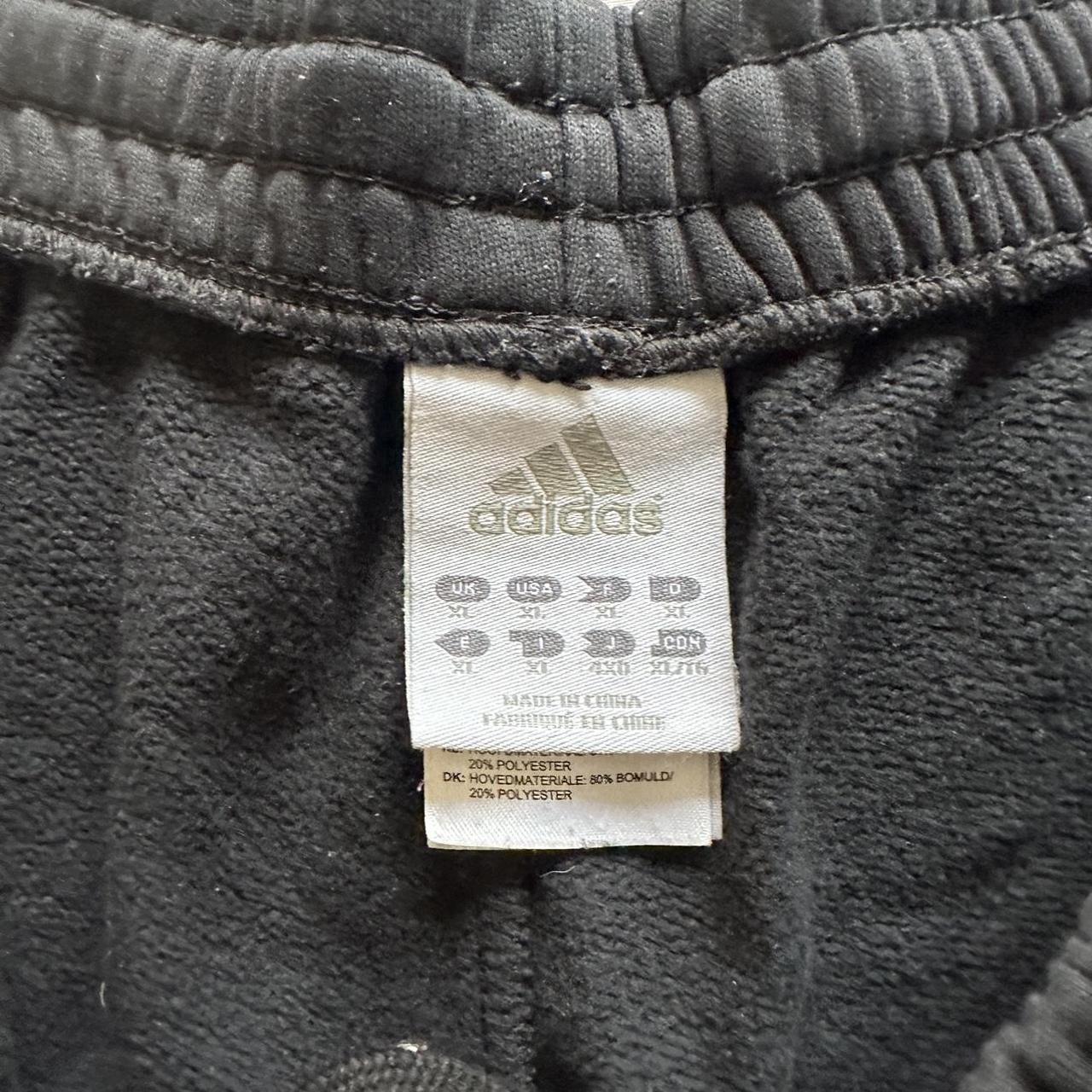 vintage Adidas tracksuit bottoms in black + gold... - Depop