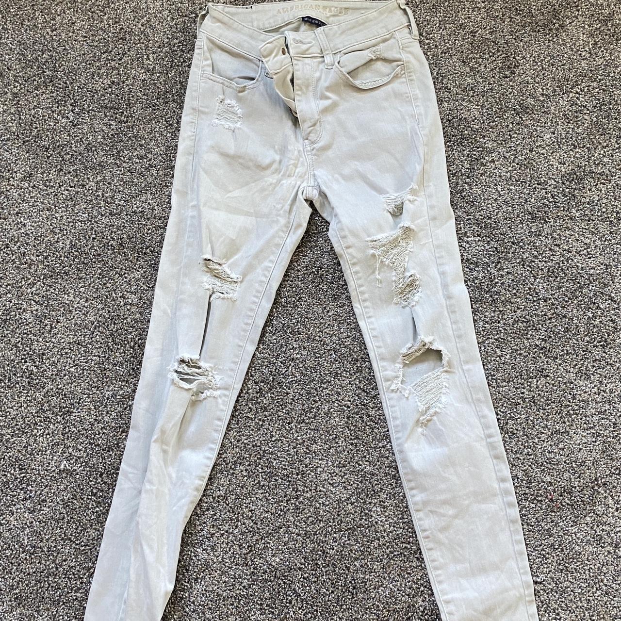 American Eagle ripped off white jeans Size 4 - Depop