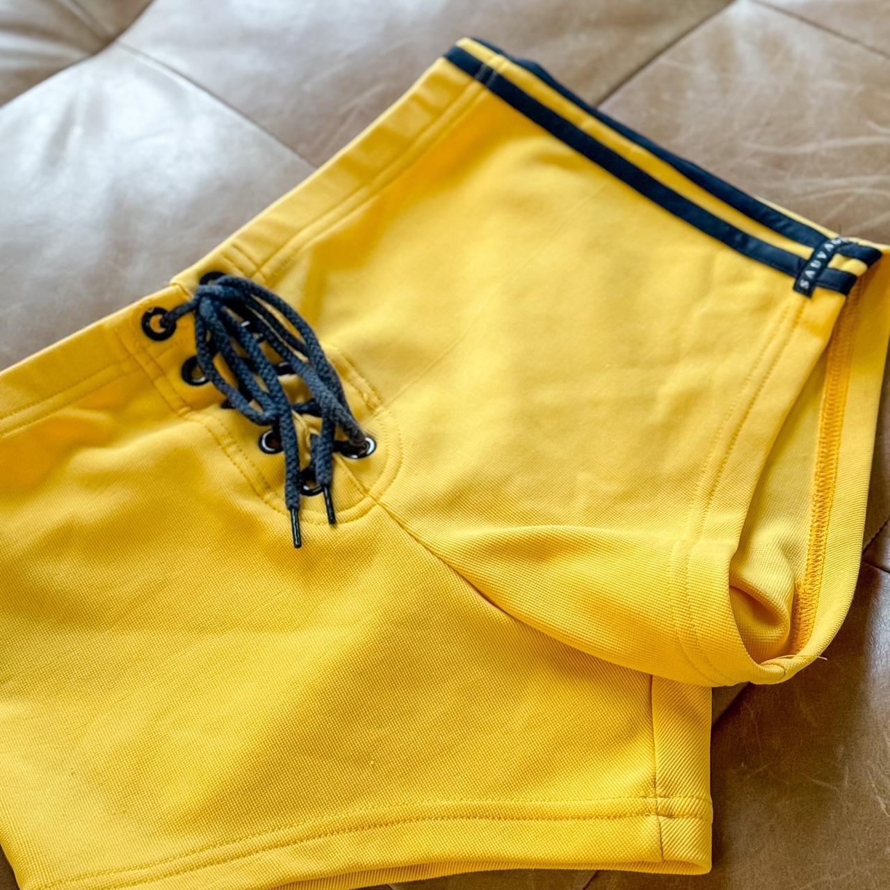 Yellow athletic shorts by Sauvage California.... Depop