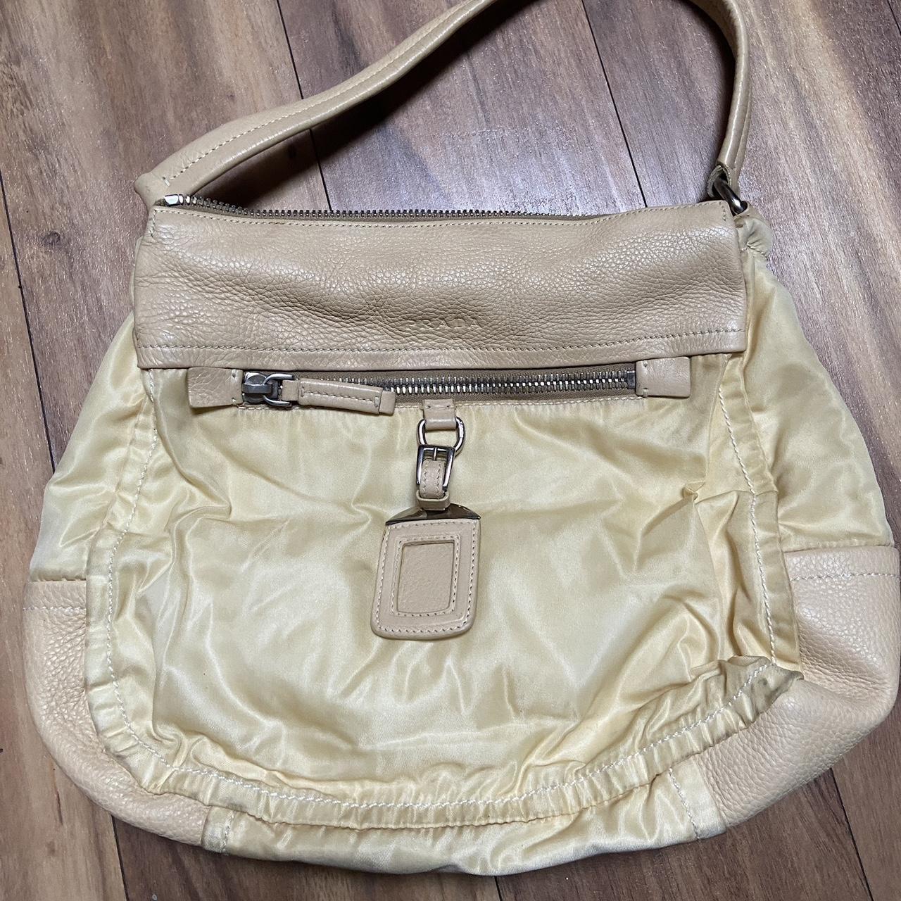 Cream discount prada bag