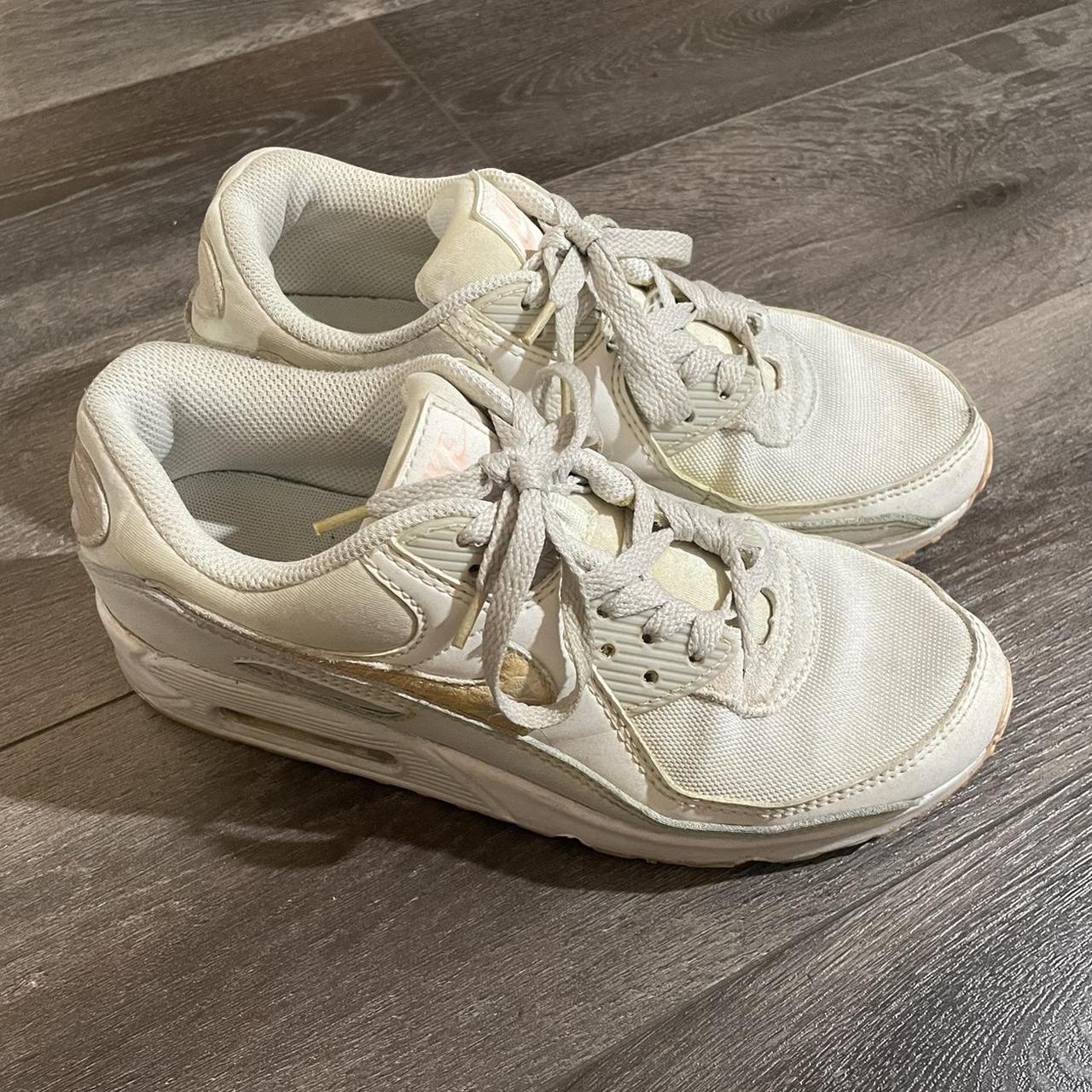 cream and black nike