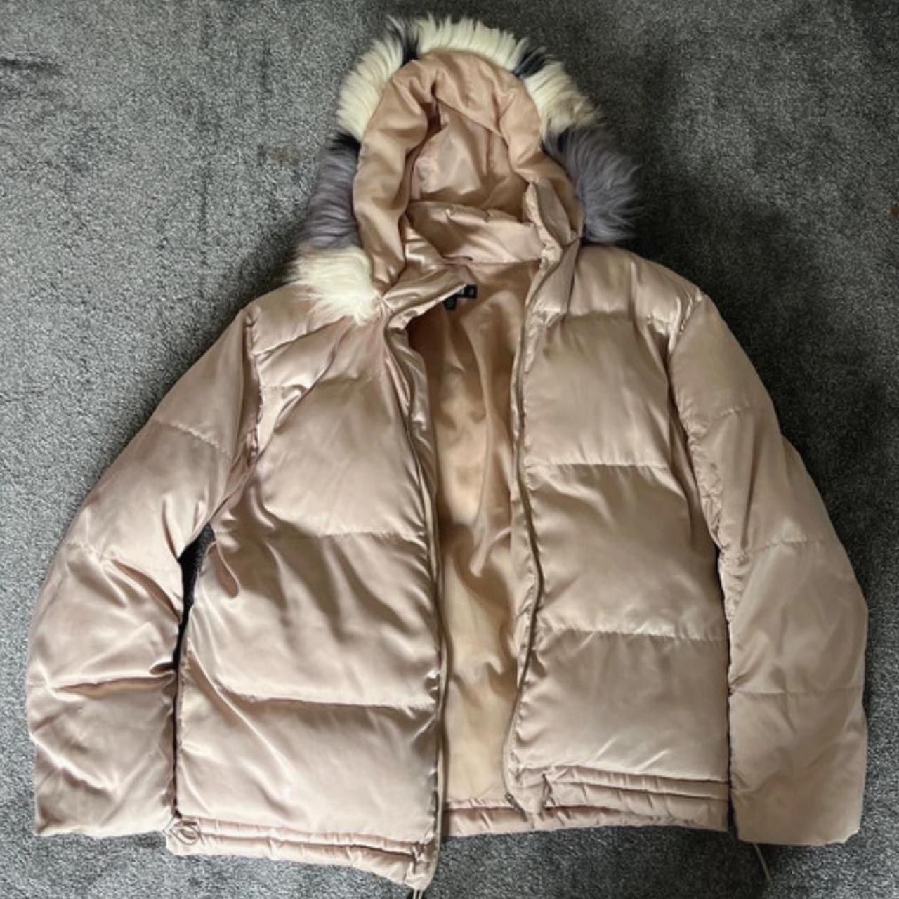 Pink and cream puffer jacket with faux-fur hood,
