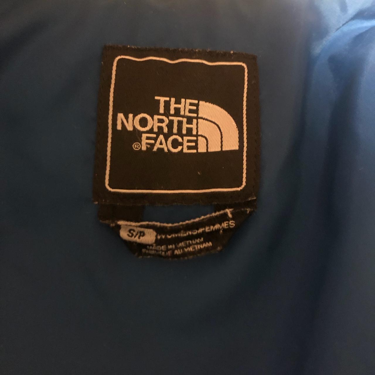 Tag of white northface gilet - Depop