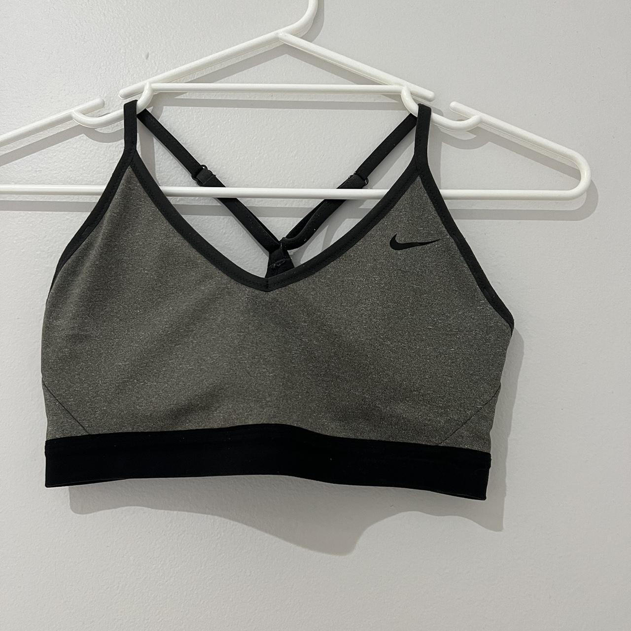 Grey Nike Sports Bra. Size Medium. Has been worn,... - Depop