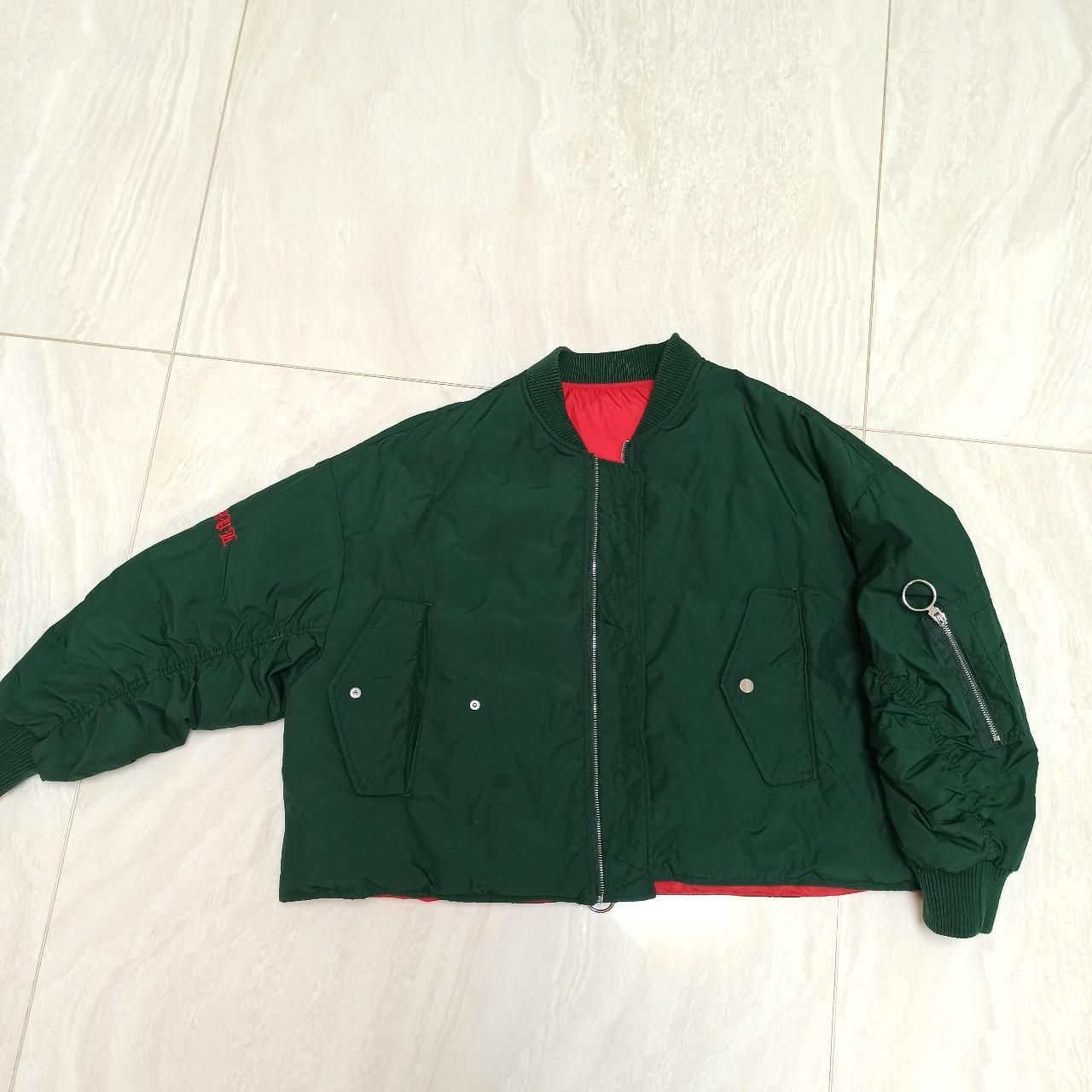 The dark green short jacket is filled with 100%... - Depop