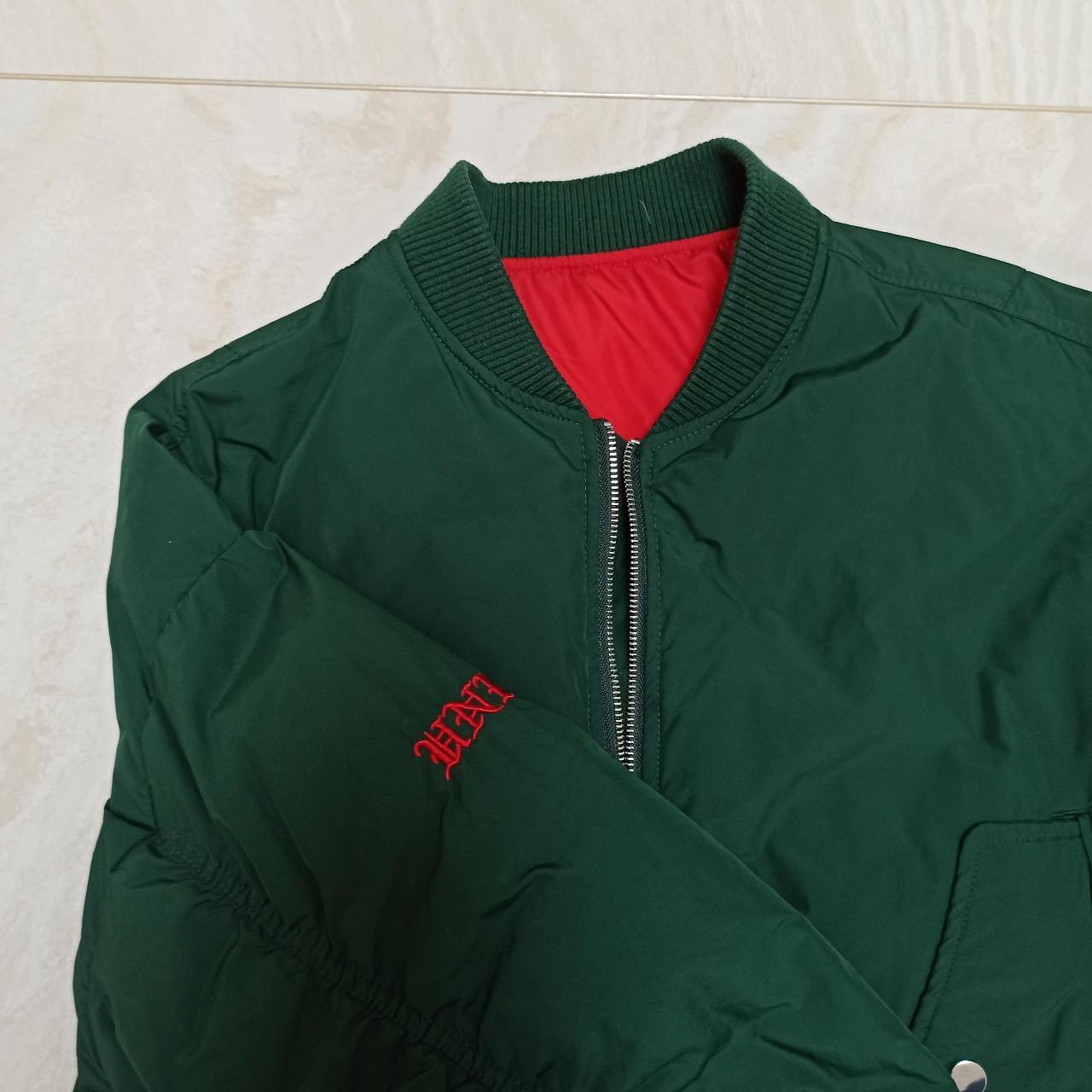 The dark green short jacket is filled with 100%... - Depop