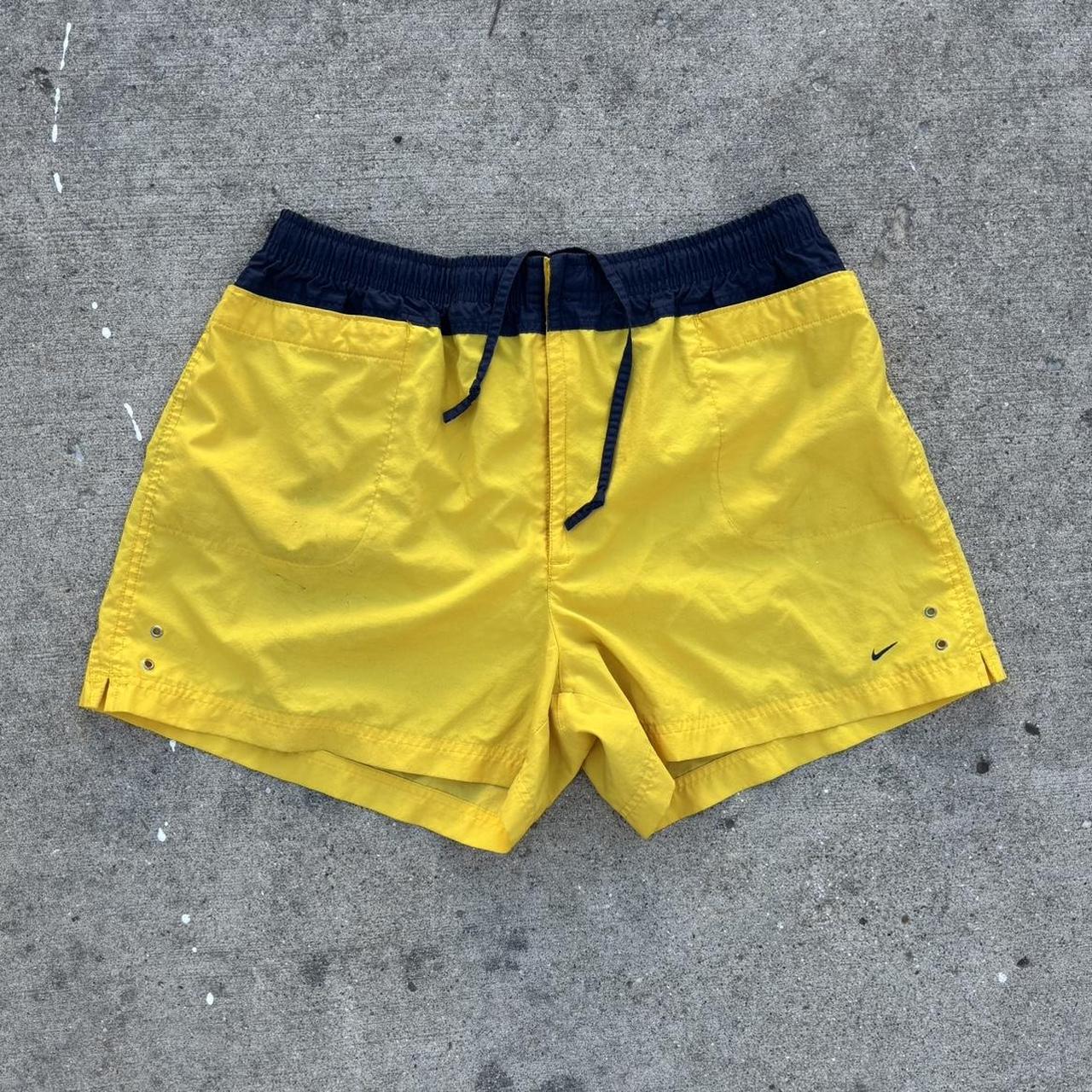 navy blue and yellow nike shorts