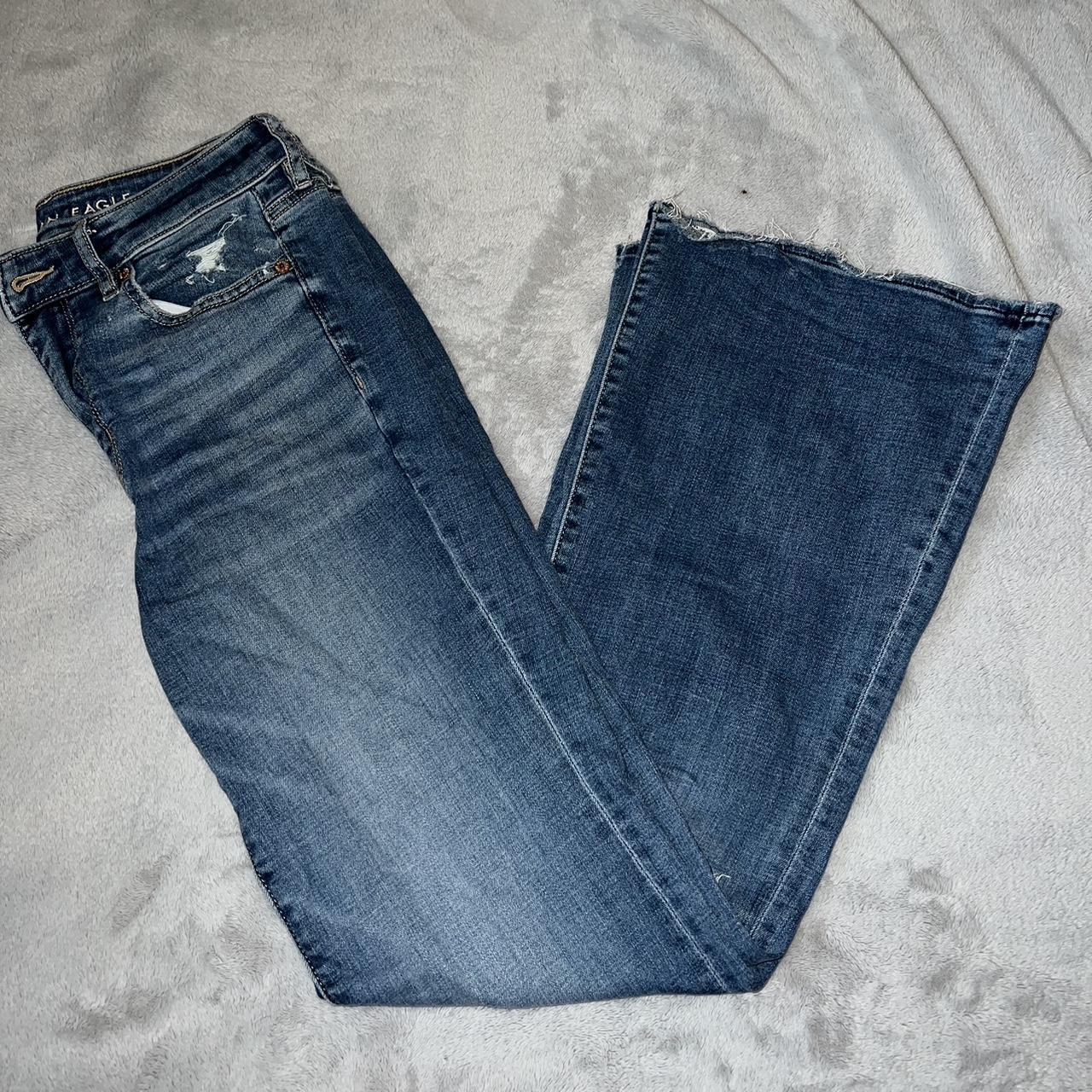 Darker wash flare jeans. Slight rip in the right... - Depop