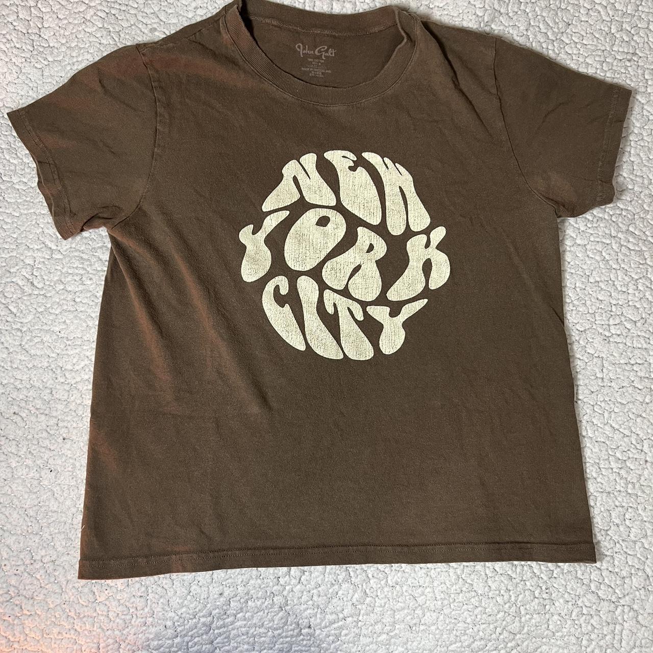 Brandy Melville brown NYC baby tee One size fits... Depop