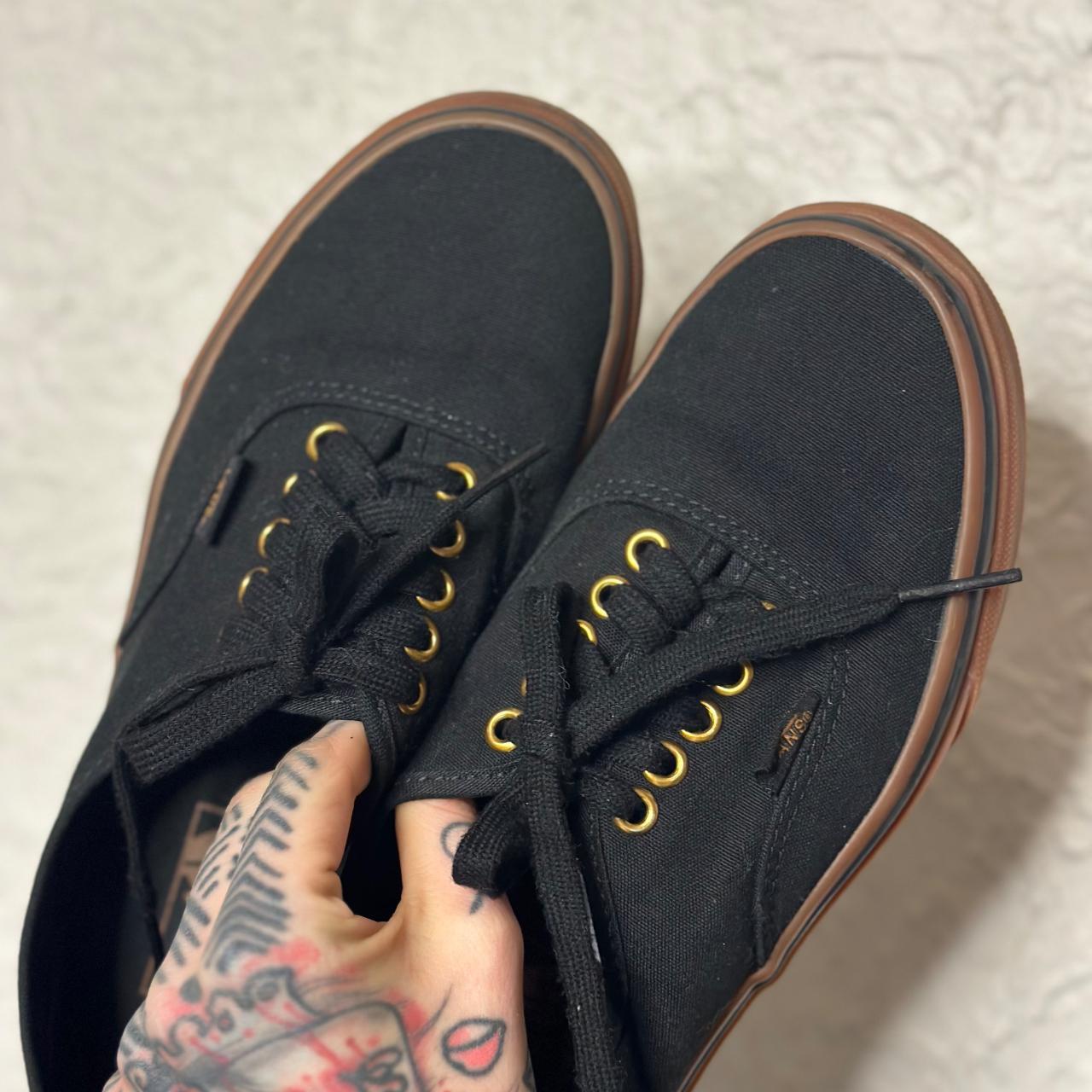 Black vans hotsell gold eyelets