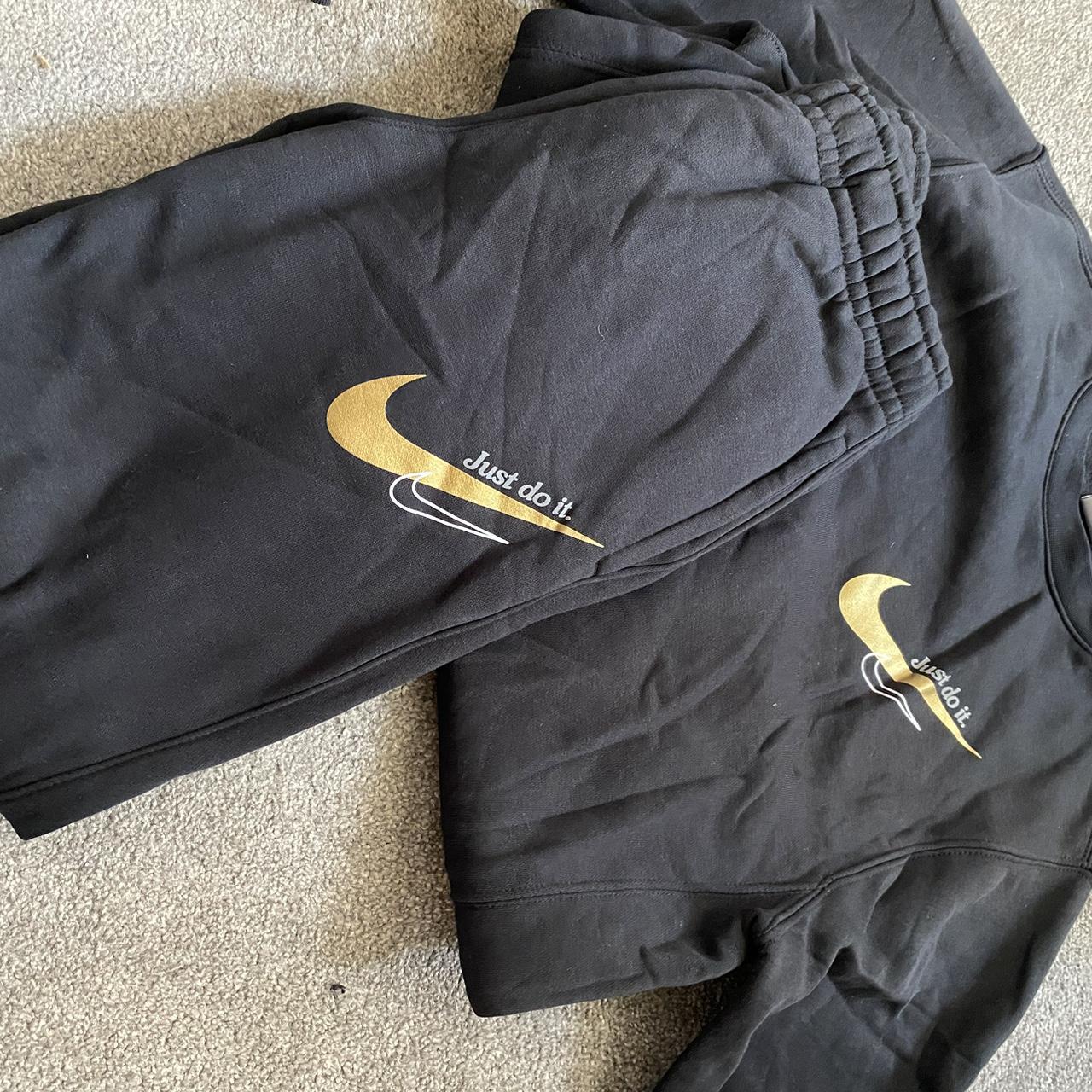 Black and gold Nike tracksuit hardly worn selling. Depop