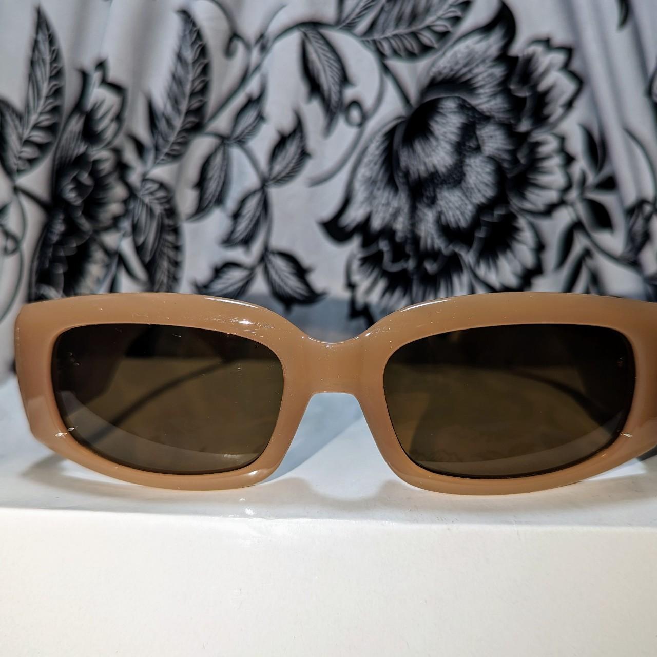 Brown sunglasses with gold detailing on the sides,... - Depop