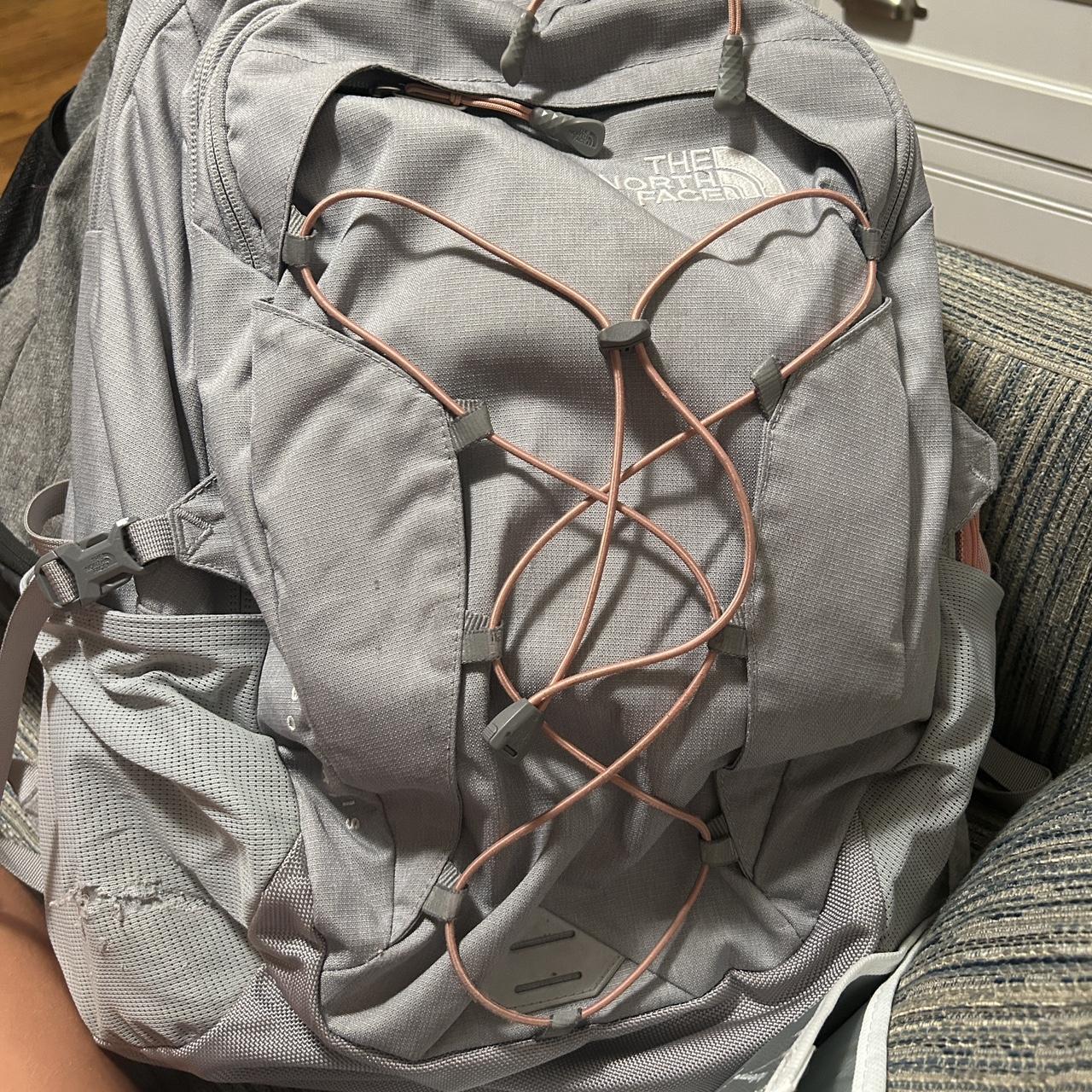 North face backpack sales grey and pink