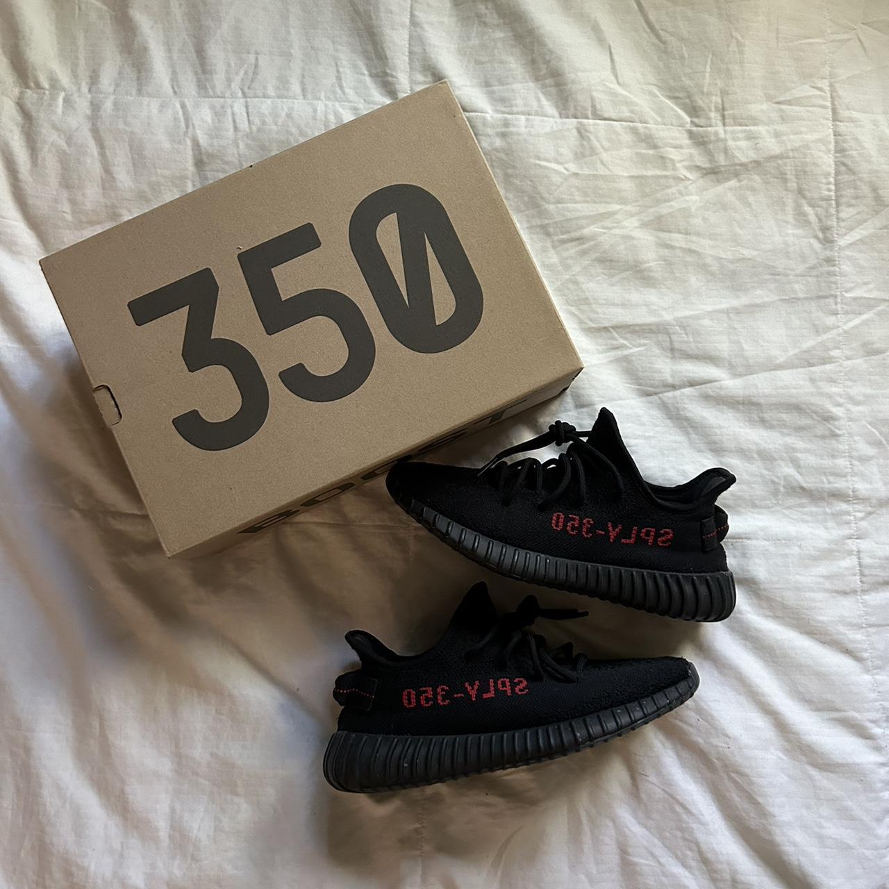 black yeezys with red numbers