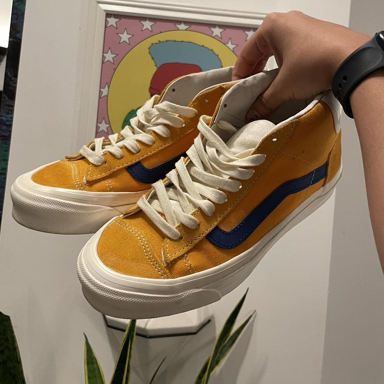 Yellow vans on store feet