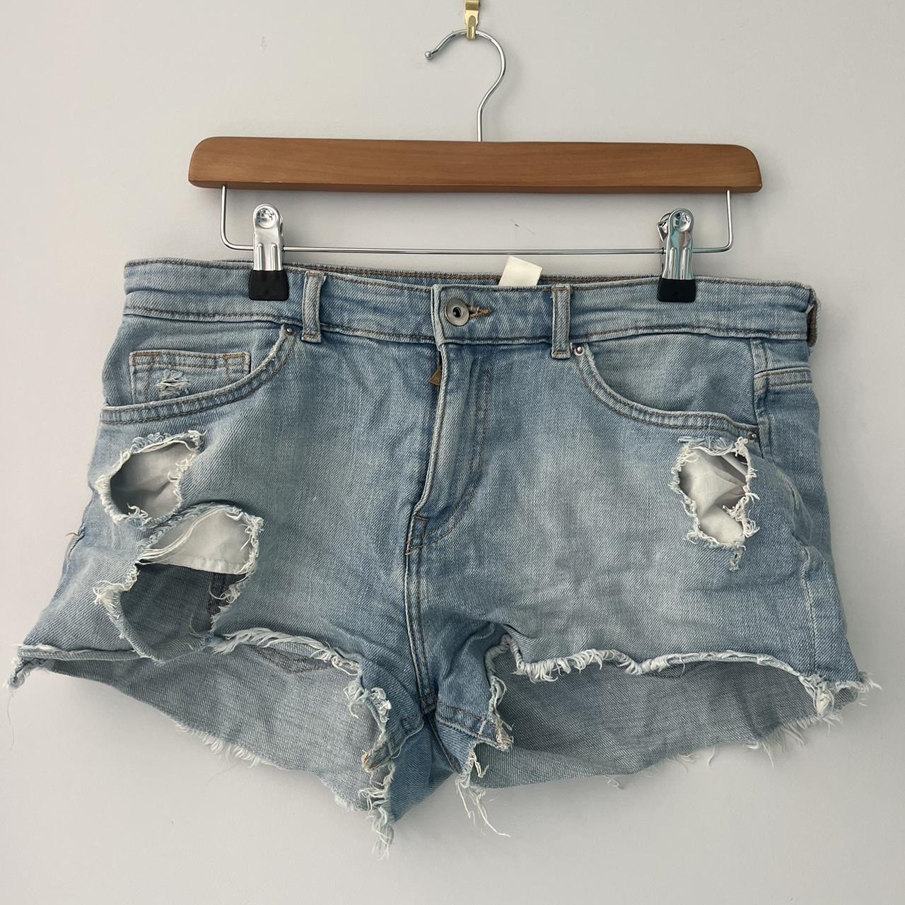 light denim shorts with purposeful holes perfect for... - Depop