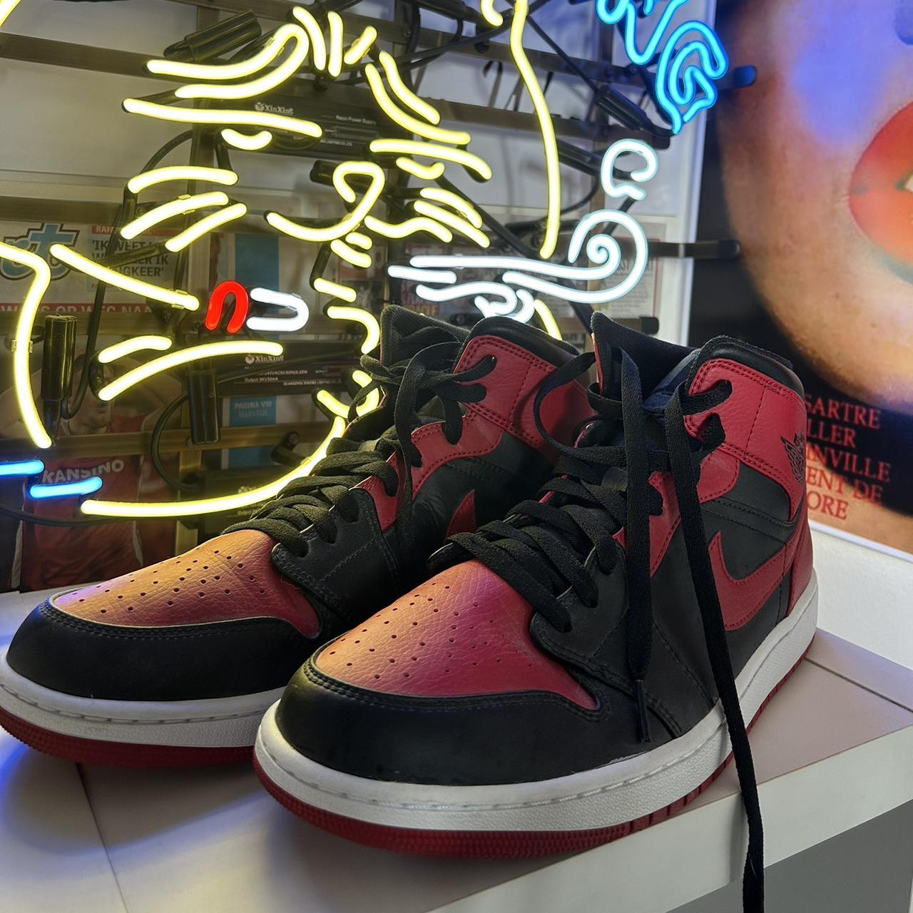 half black half red jordan ones